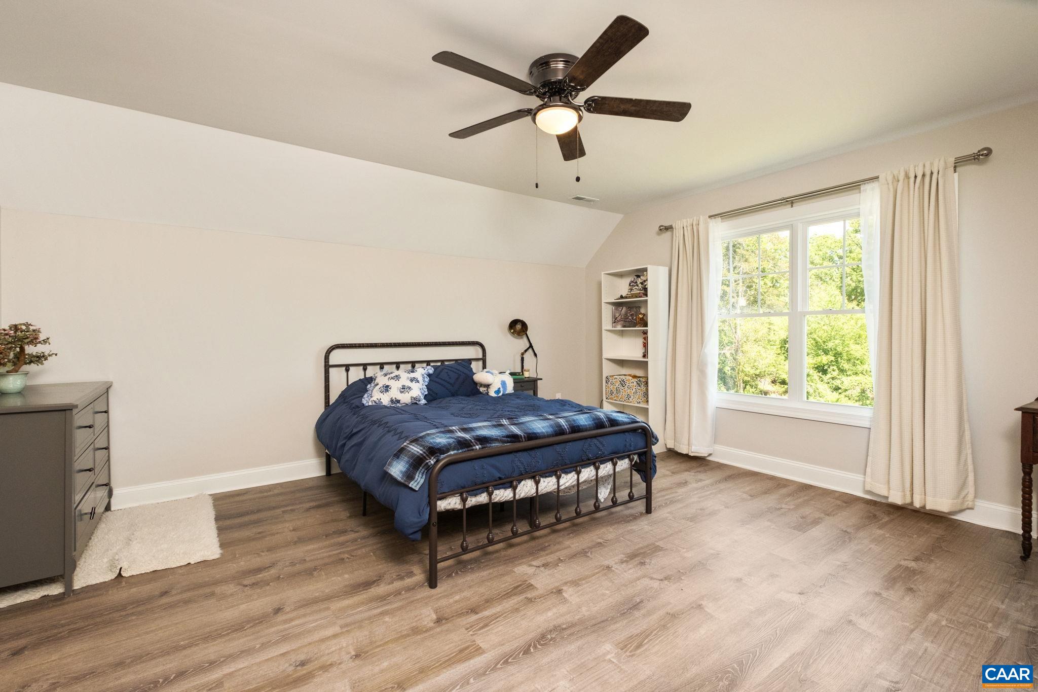 This bedroom is located on the second level, at the back right corner of the home.  It is large and has an en suite bathroom.
