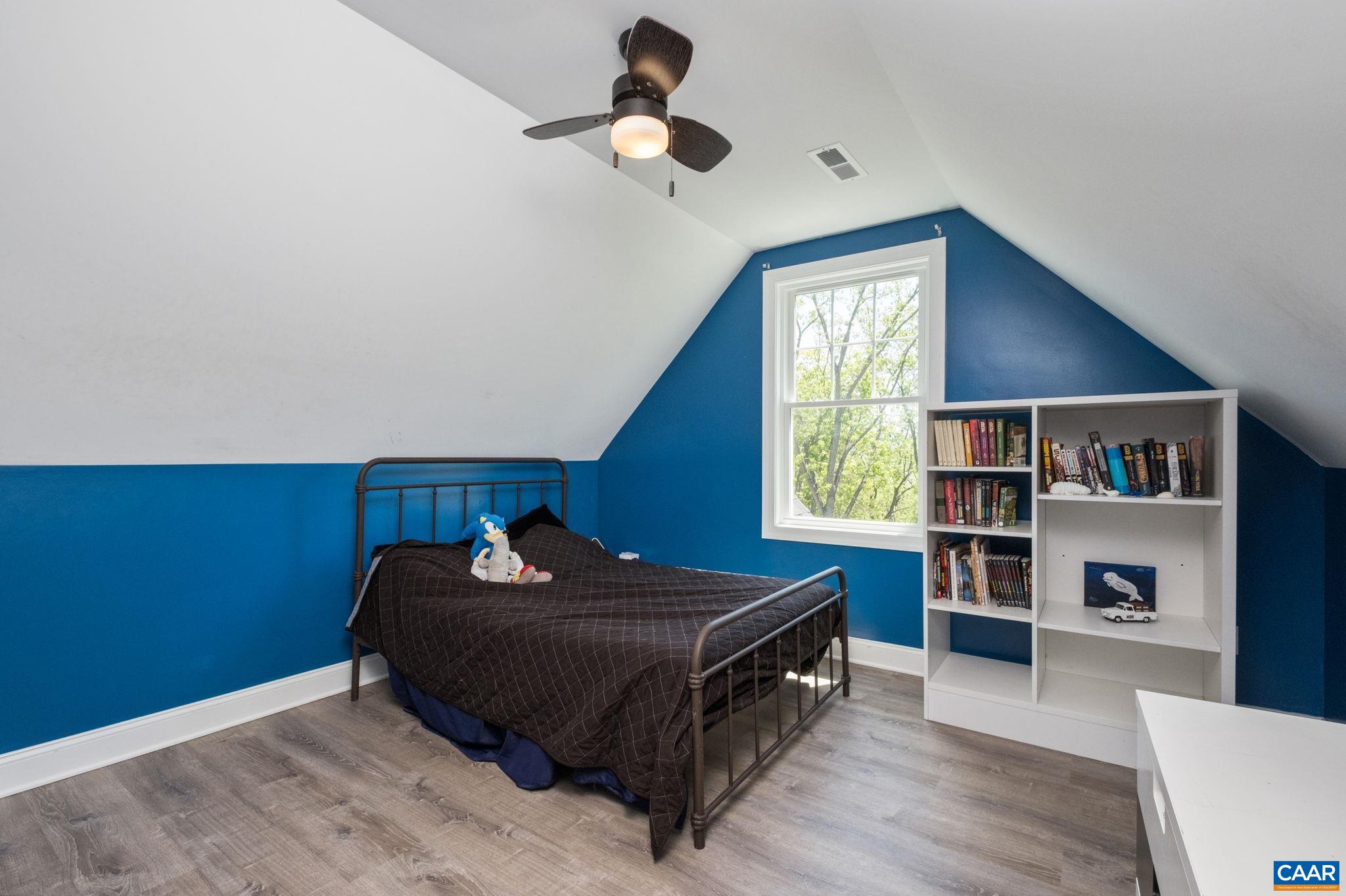 Bedroom 5 is a second primary suite, located on the second level.
