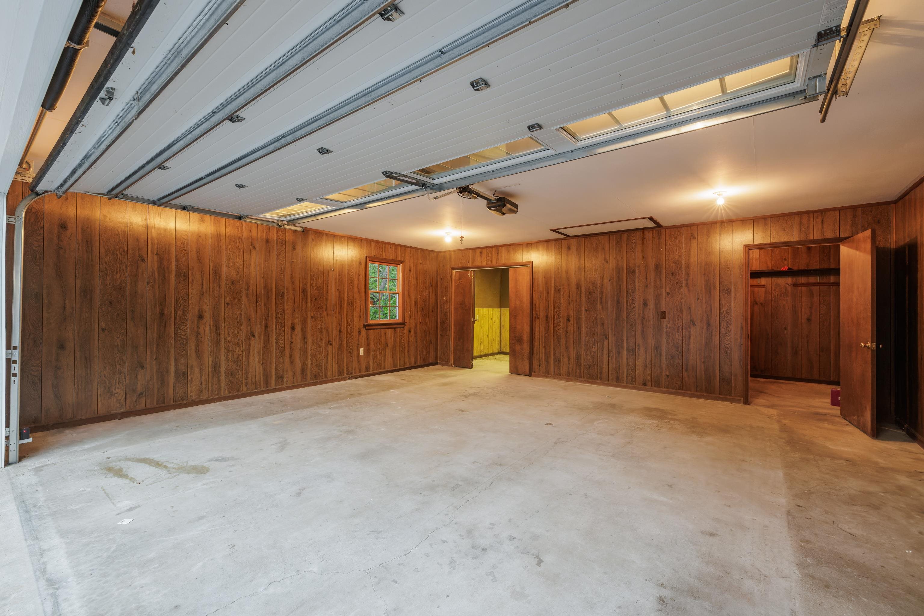 workbench and storage area in back section of garage