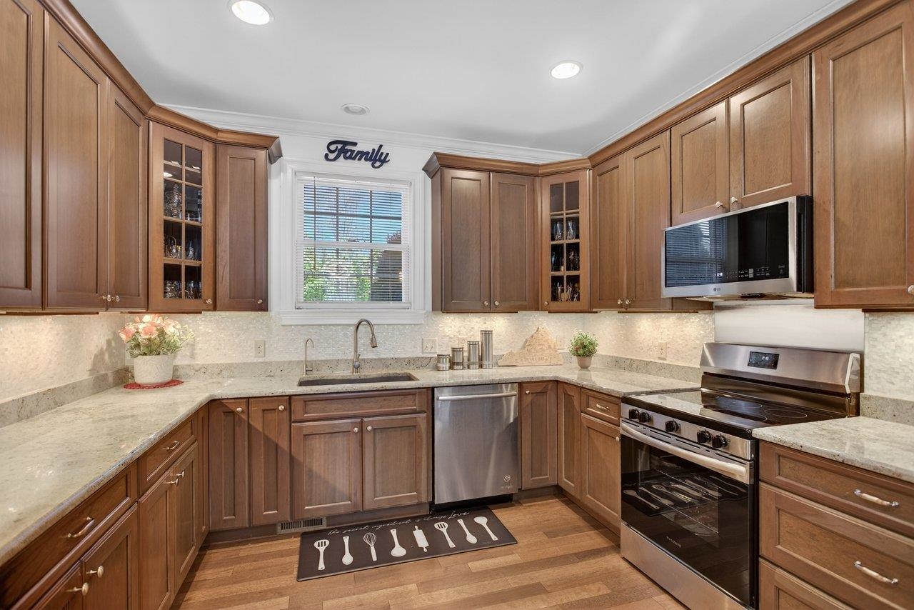 The stainless steel appliances include refrigerator, dishwasher, microwave and brand new electric range
