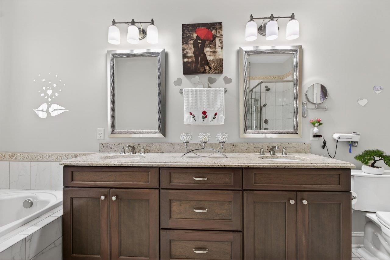 Tile floor, soaking tub, double vanities, separate shower and good size linen closet
