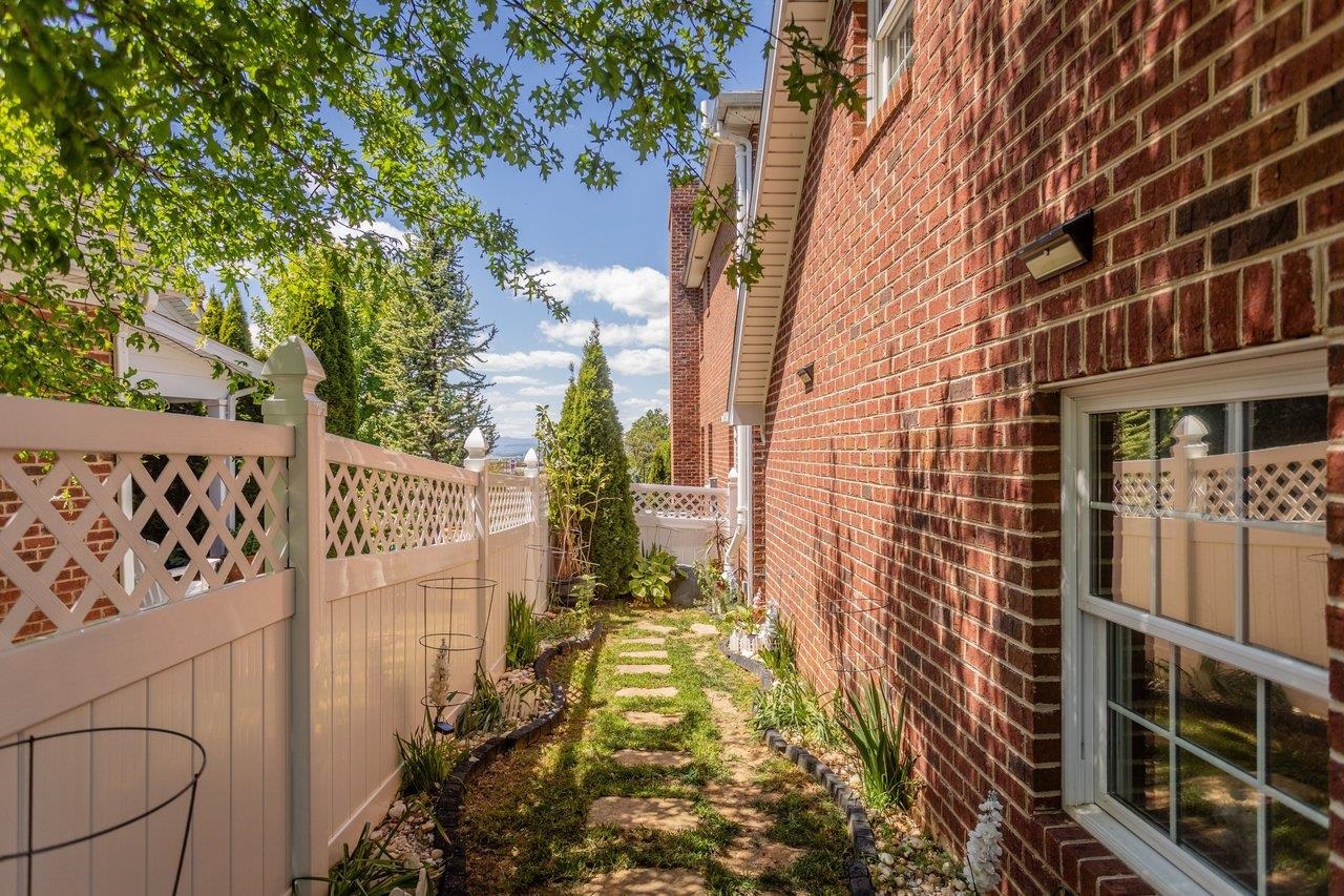 The completely fenced yard offers privacy
