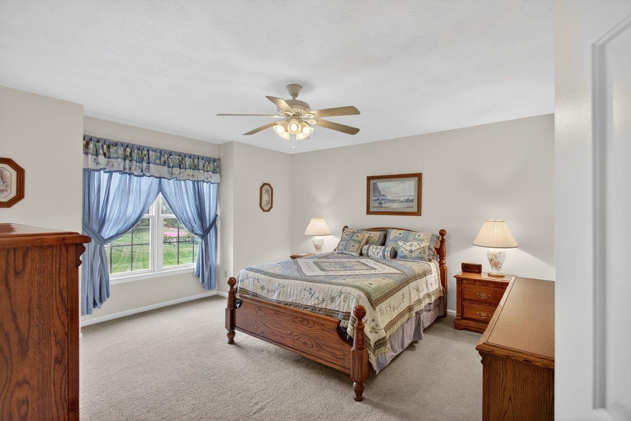 Features; carpet, ceiling fan and a private bath.