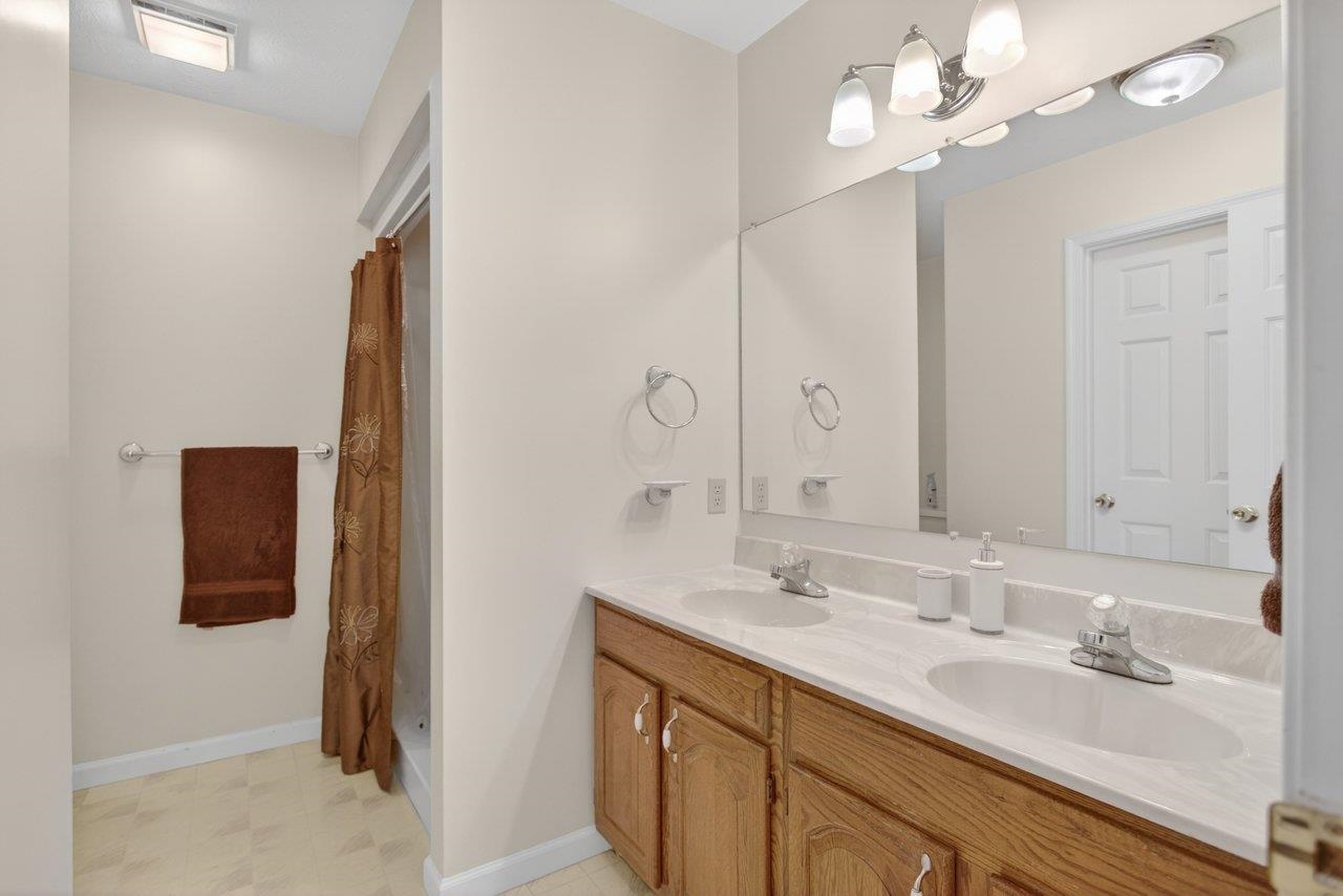 Features double sinks and a large shower.