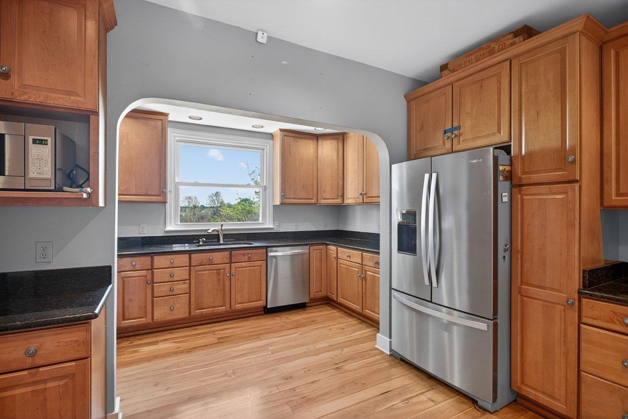 This spacious kitchen also has eat in space.