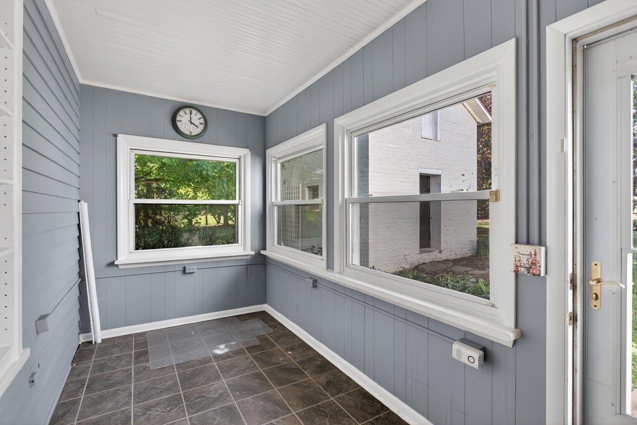 This is a mud room/pantry/enclosed porch area off the kitchen.