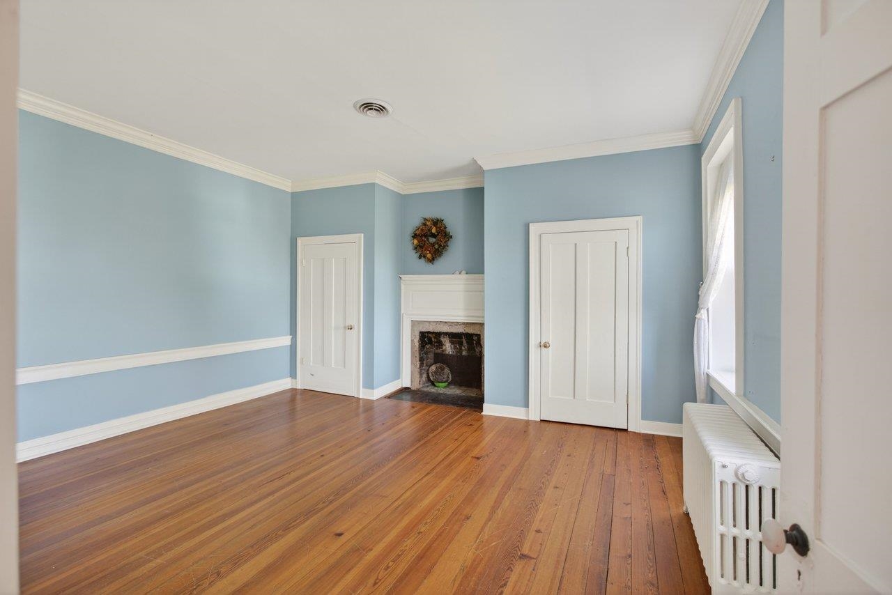 This bedroom situates on the front part of the home on the second level.