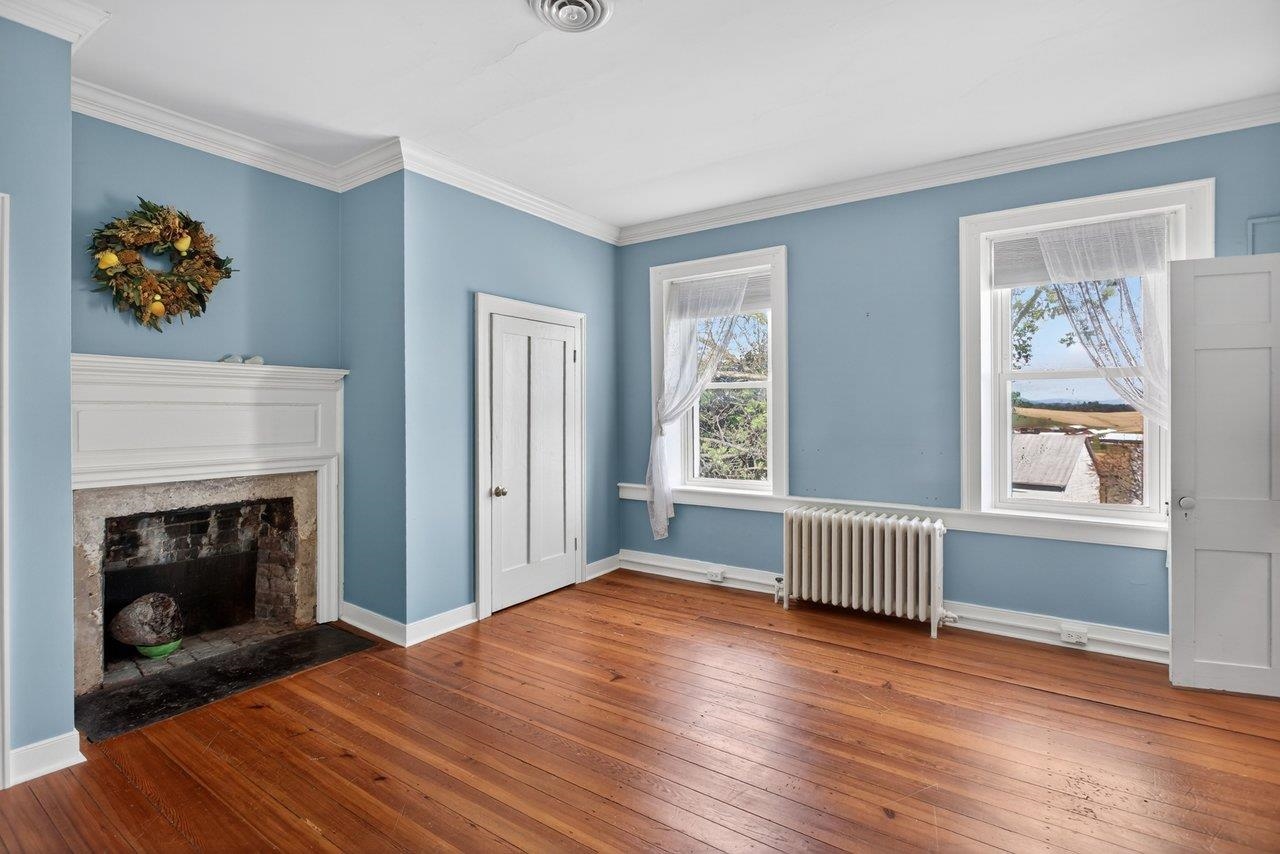 This bedroom has two closets and a fireplace!