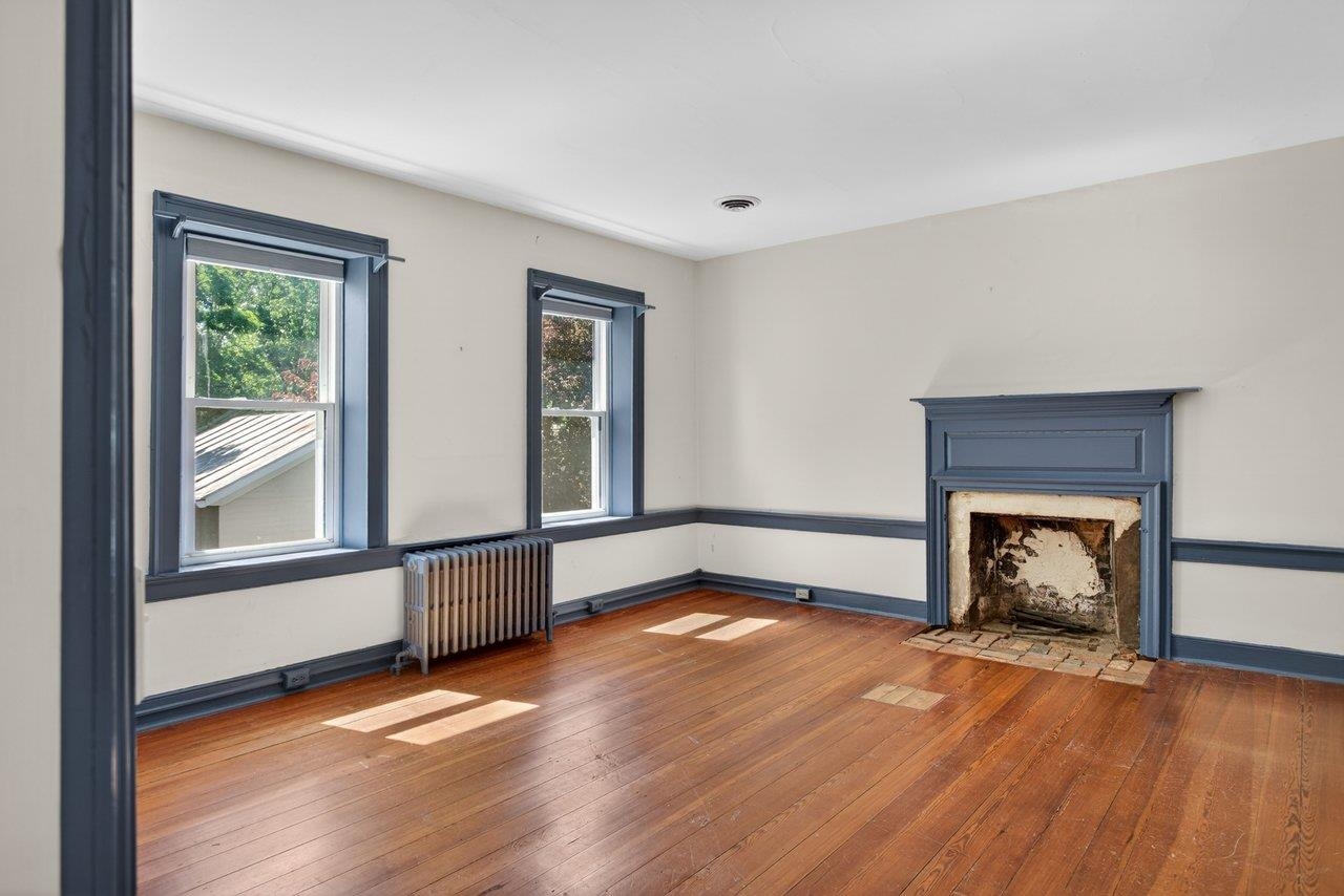This bedroom is located at the top of the stairs to the right.