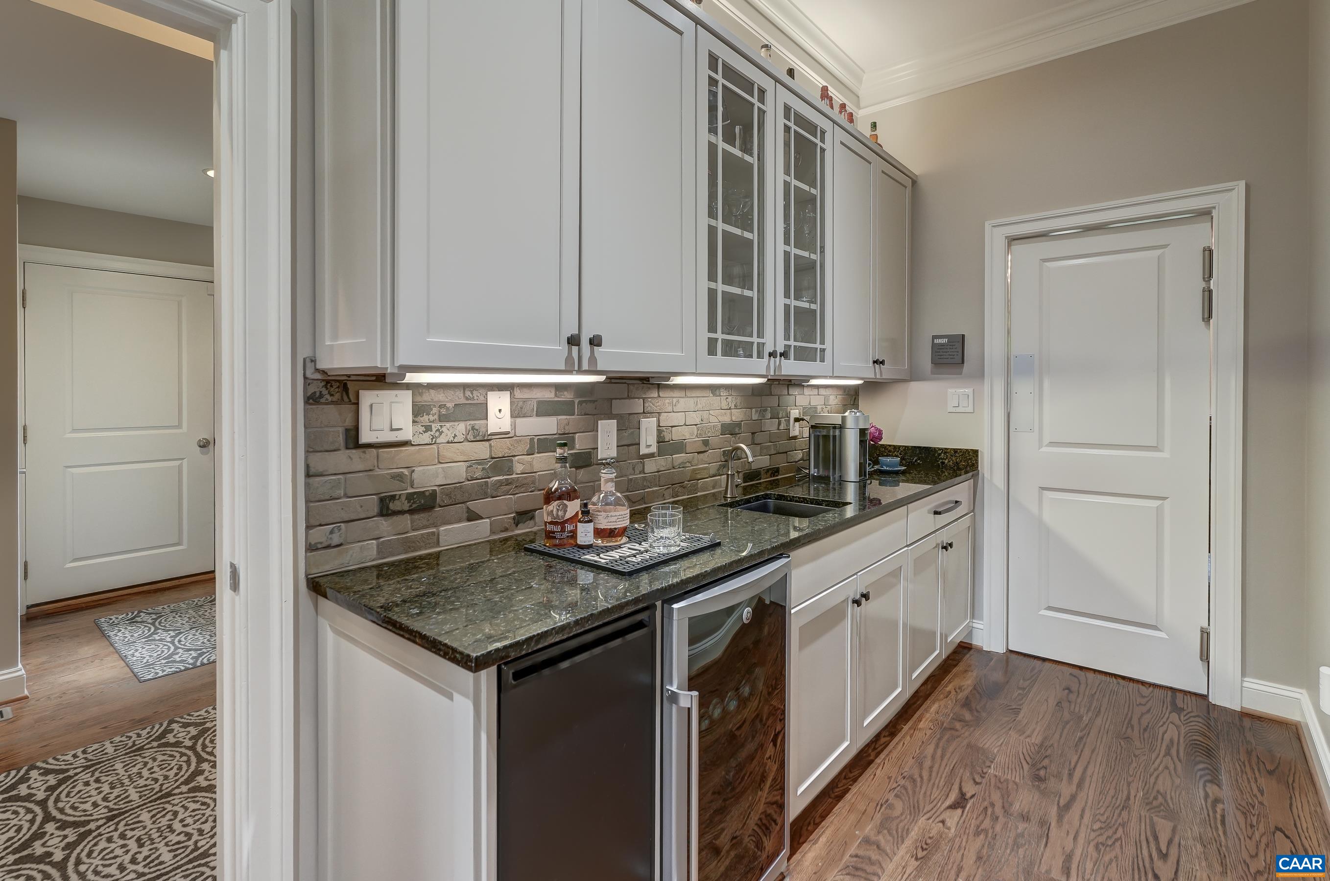 Butlers pantry with wine cooler and more storage!
