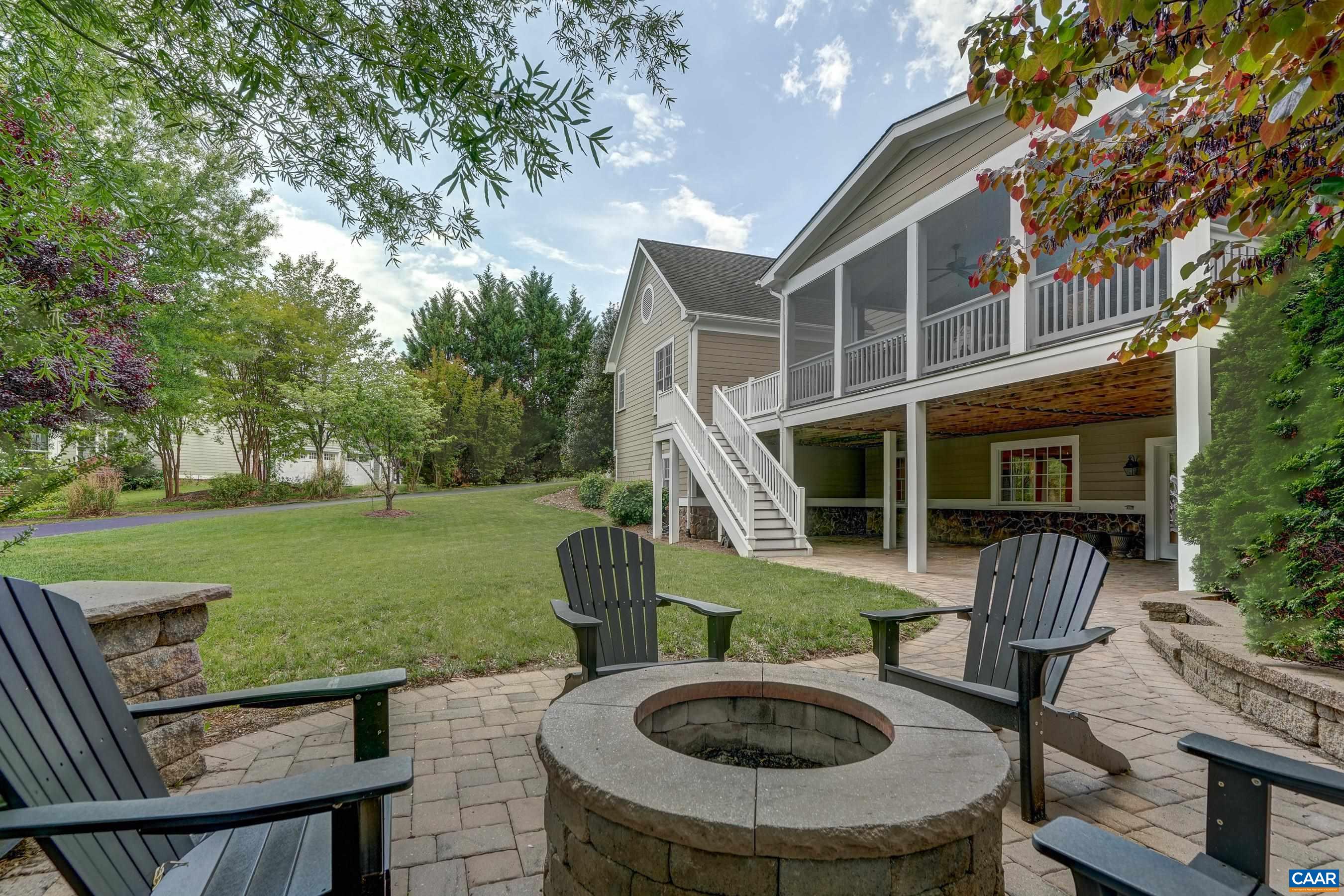 Multiple outdoor living spaces including this spacious paver patio with gas-plumbed fire pit.