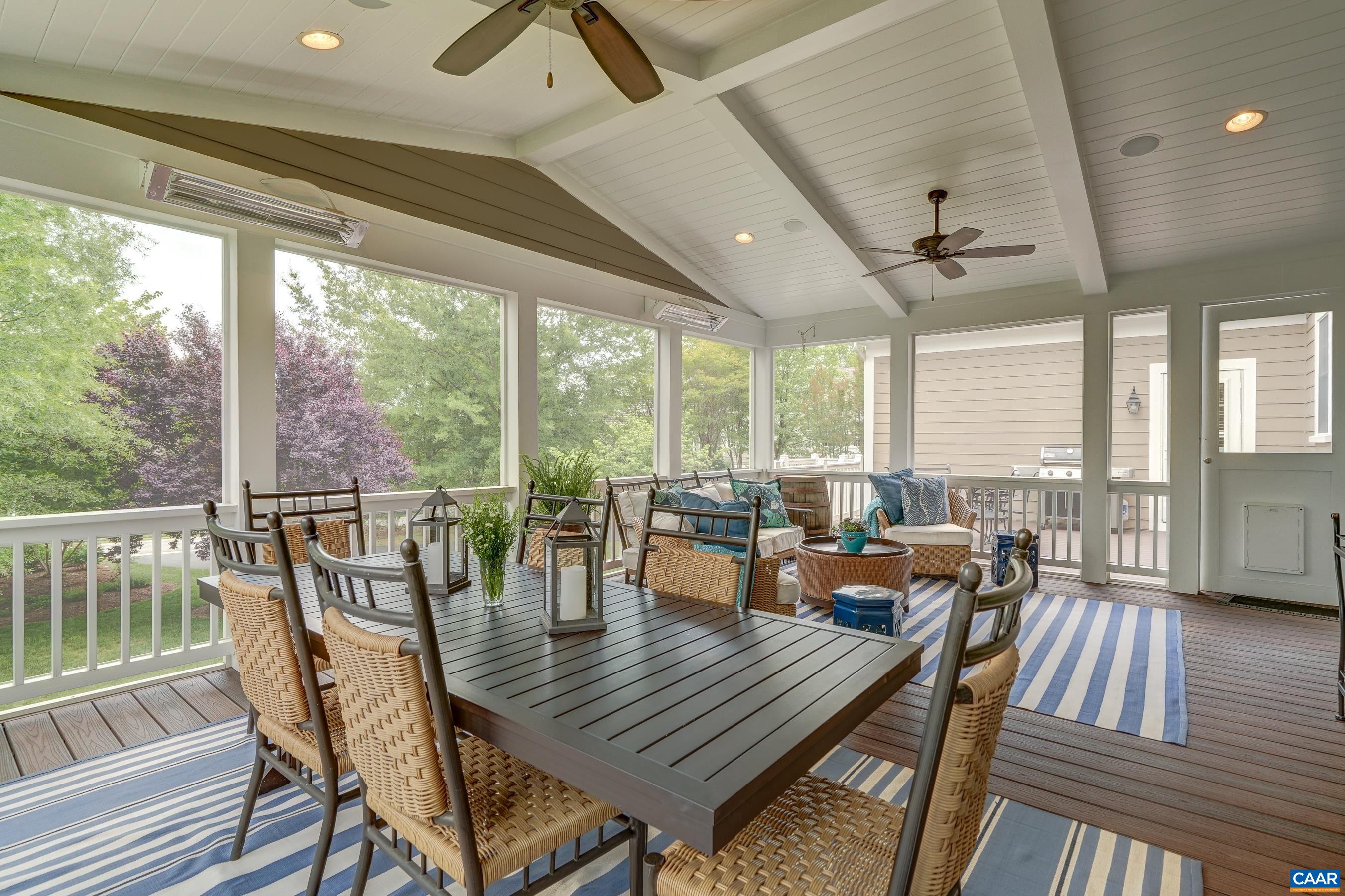 Yea- round living in the trees on this expansive screened porch with infrared heaters to enjoy on even the coolest days.