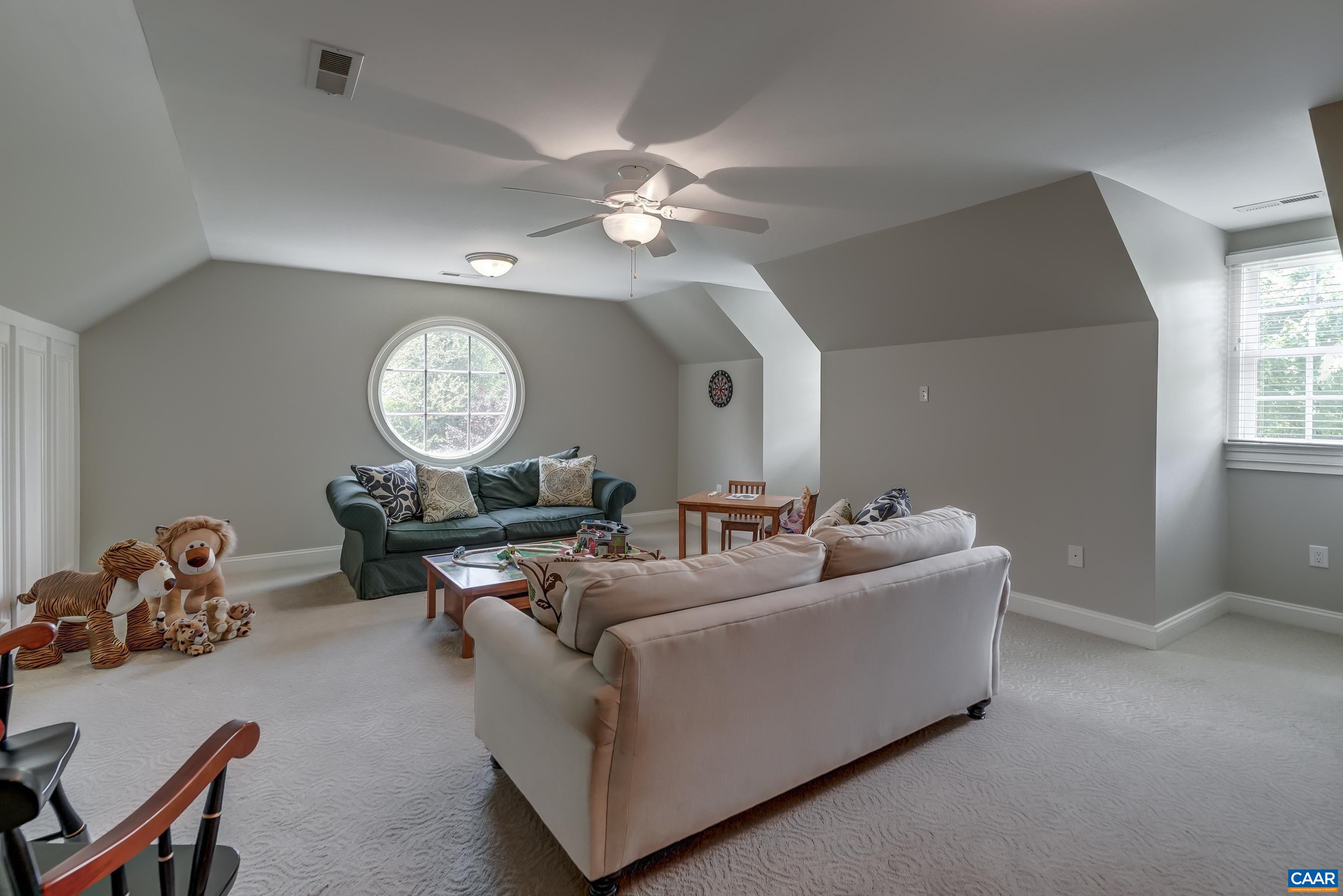 Huge bonus room above garage is an amazing play space or media room!