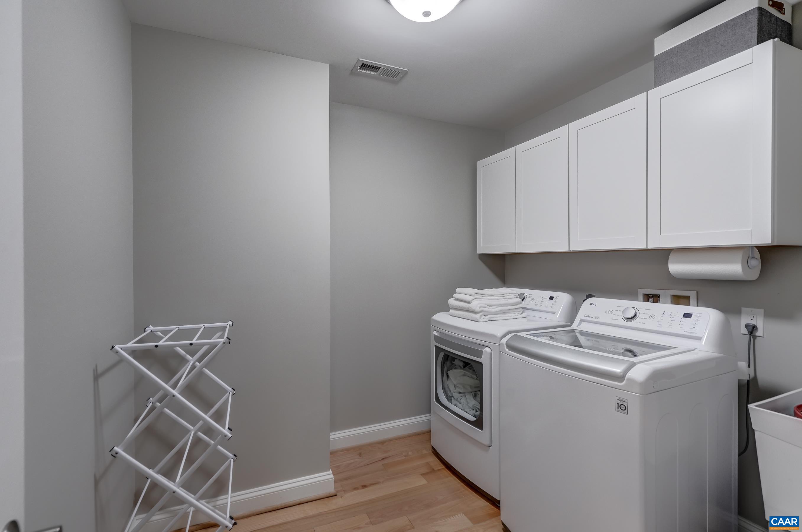 Laundry room with storage on second floor