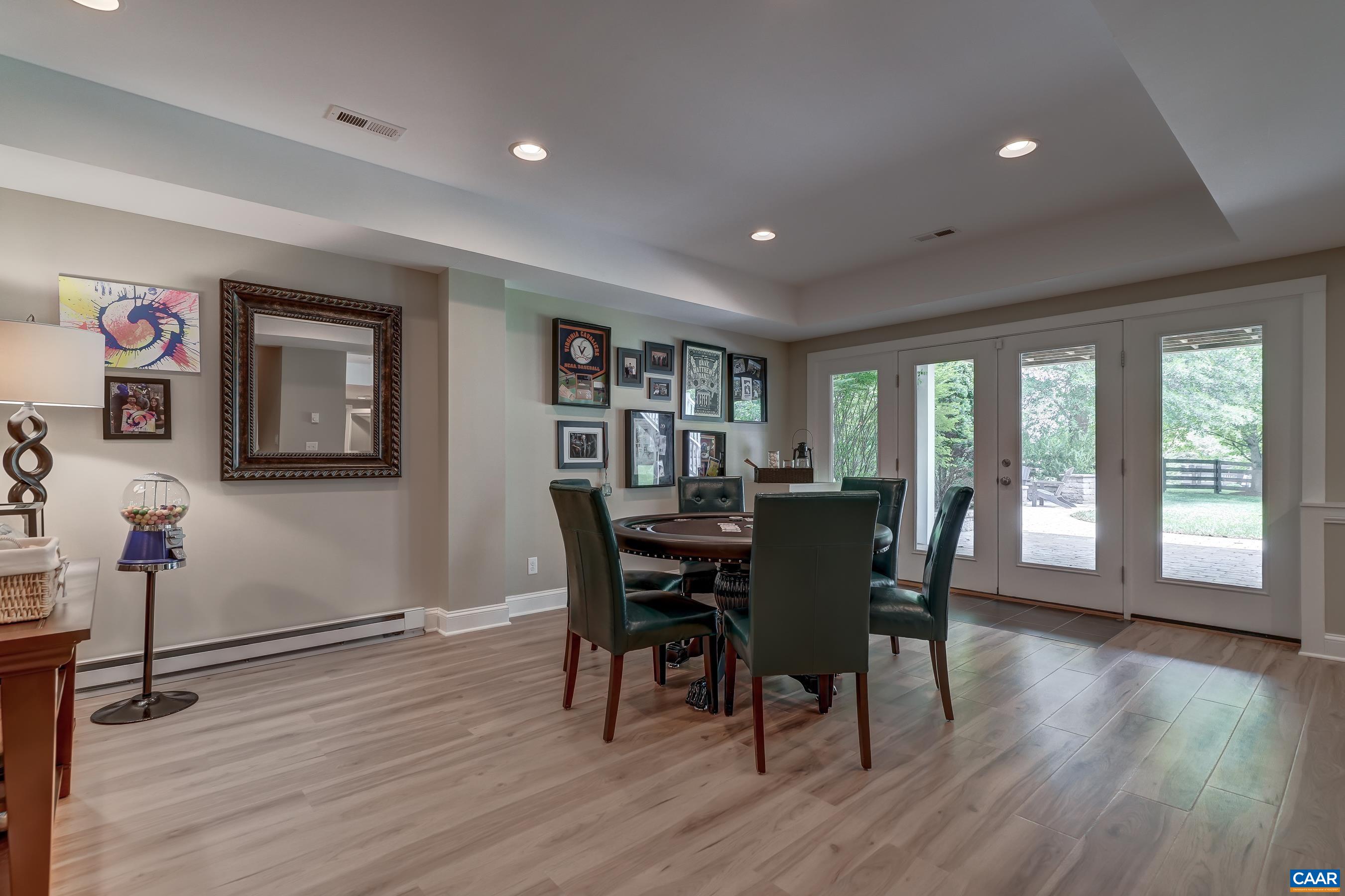 Stunning finished basement features baseboard heating, luxury vinyl plank flooring and is the perfect spot for hosting!