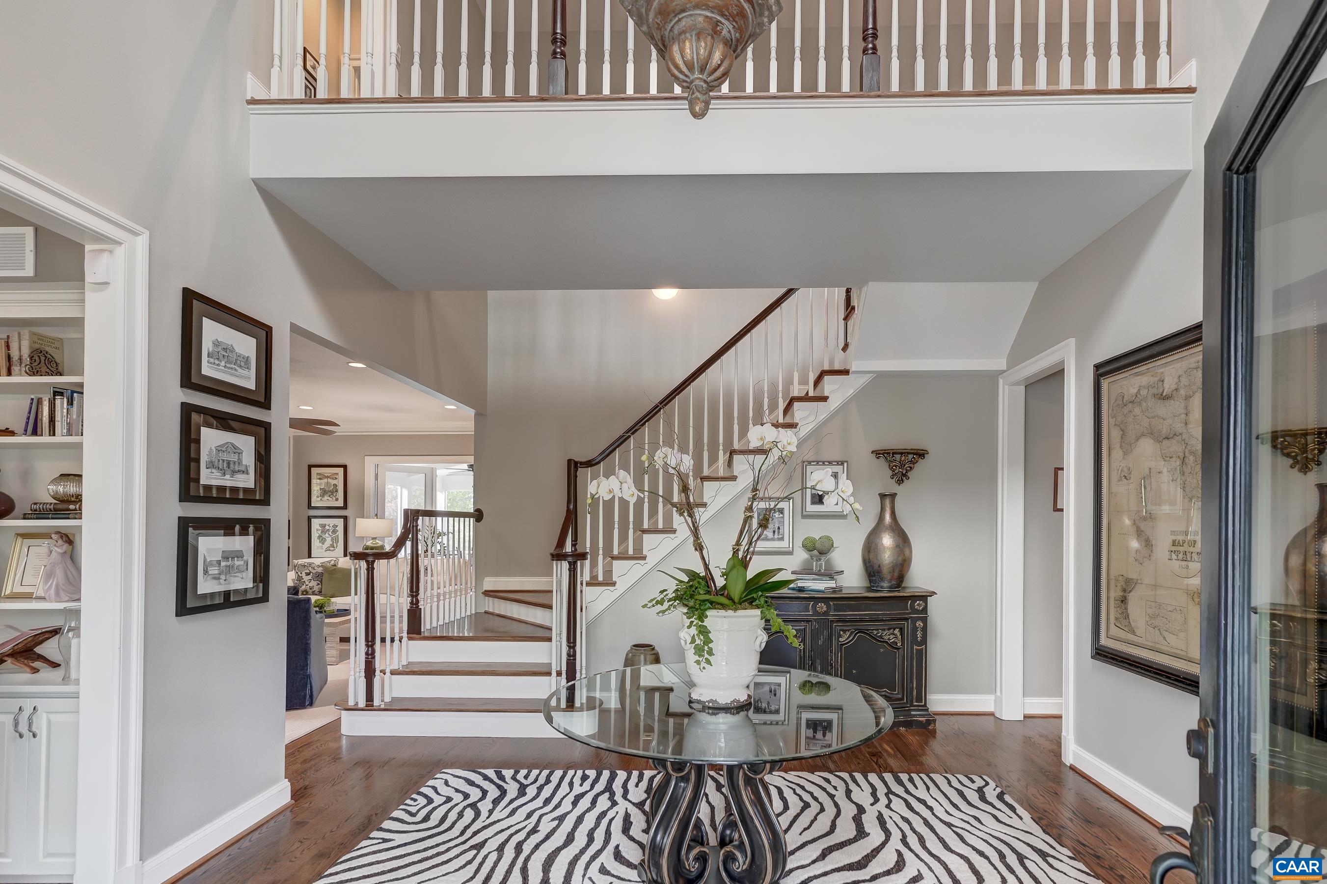 This lovely home features hardwood floors throughout the main level, and stylish high-end decor in every room!