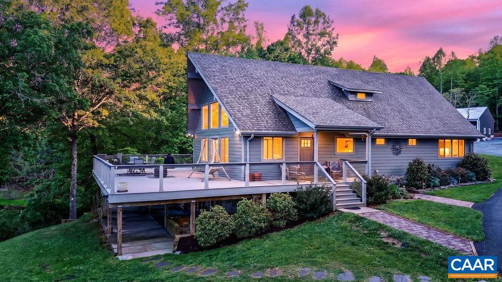 This property offers nearly 3,000 square feet of living space, complemented by a large pole barn and a detached oversized two-car garage with dedicated workshop space.
