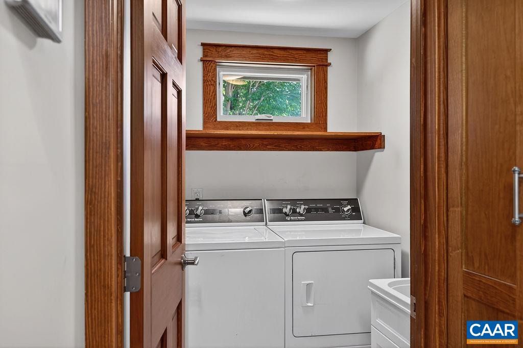 The main-level laundry room is thoughtfully designed and also includes a utility sink.