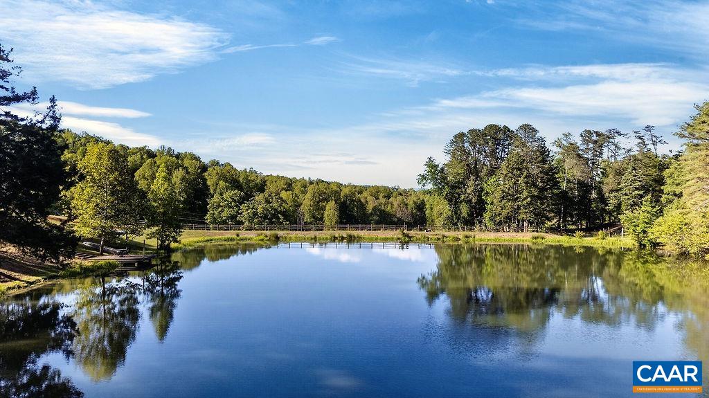 Nearly 2-acre spring-fed pond offering the perfect setting for fishing, swimming, kayaking, and creating unforgettable memories with family and friends.