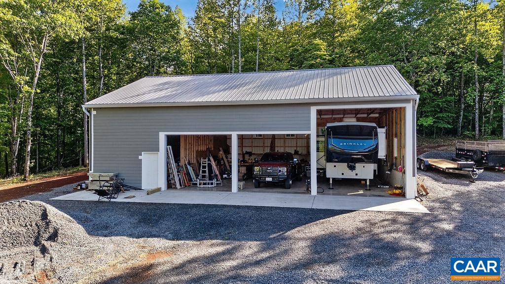 The impressive pole barn features a large RV bay with 16-foot clearance, while a portion of the space has been framed for a hobby room or workshop. Electricity is in place, making this an incredibly versatile addition to an already stunning property.