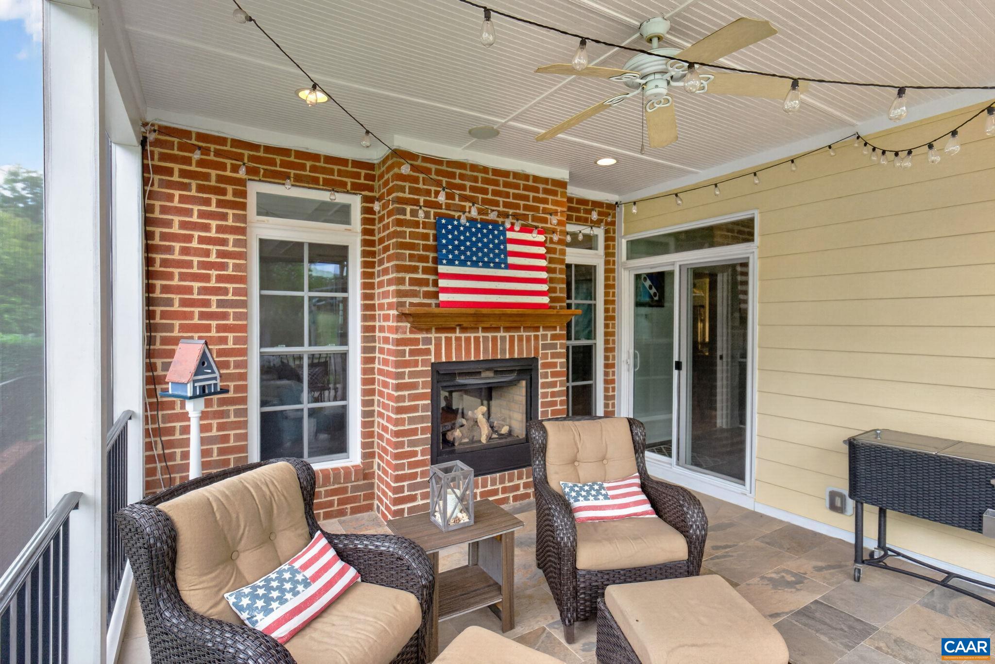 Screen porch with lights, ceiling fan, built in speakers and gas fireplace.