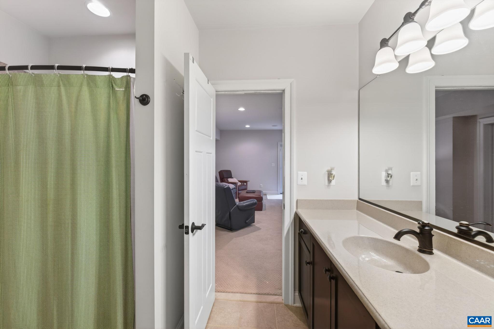Lower level tiled full bathroom.
