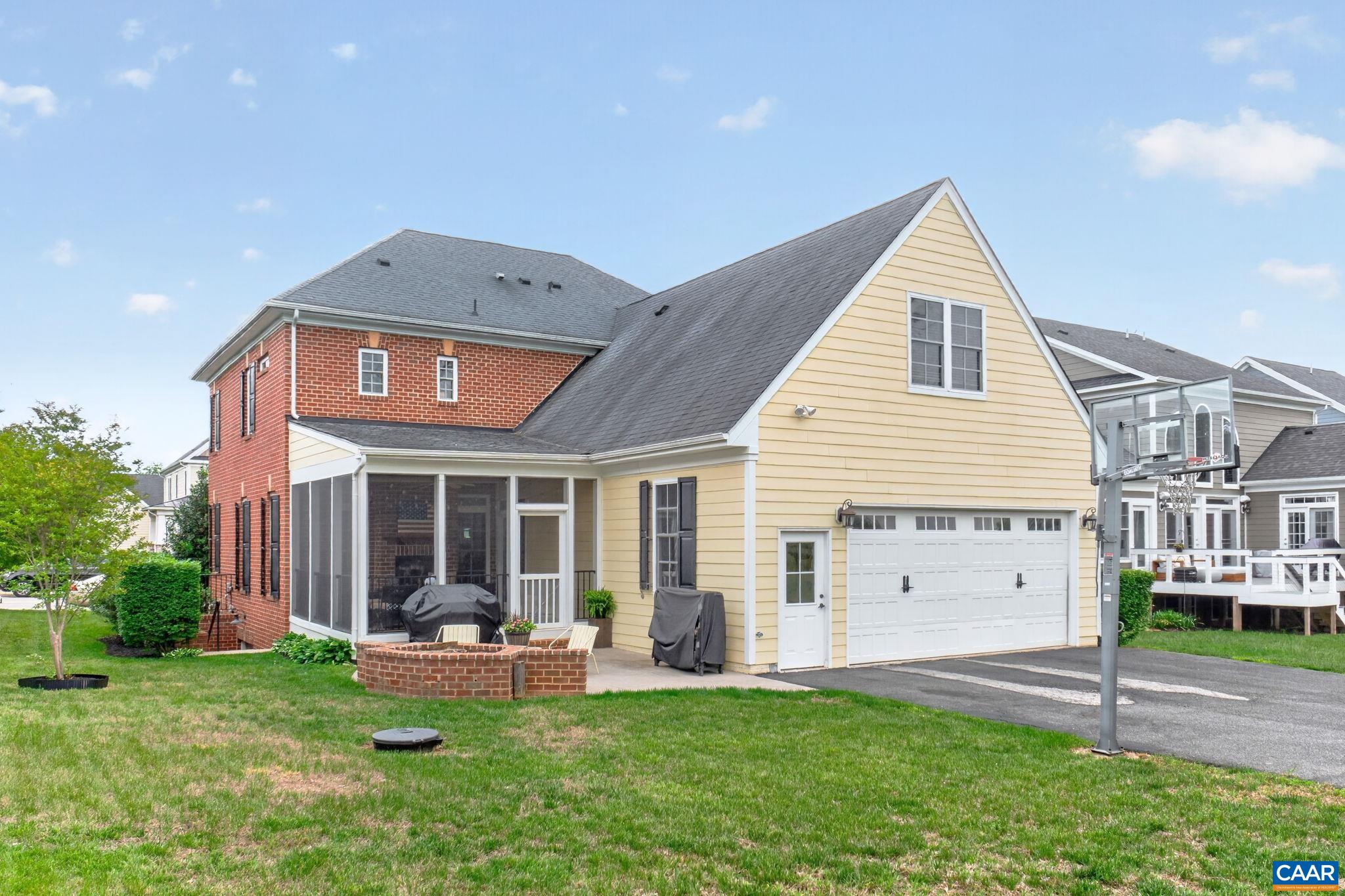 Oversized 24'x26' two car garage has ceiling fan and large utility sink.