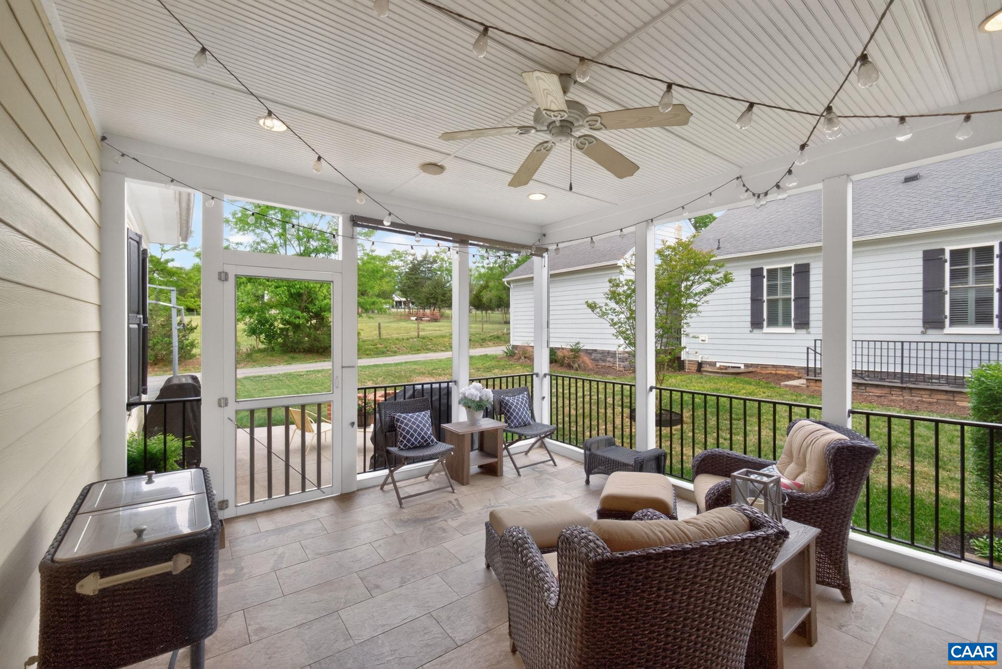 Screen porch off family room with pastoral and mountain views.