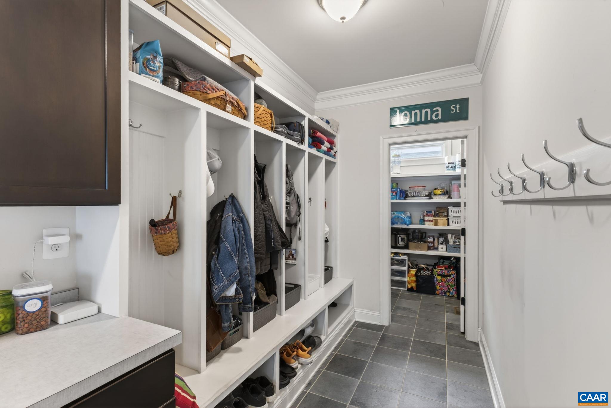 Large mudroom with 6 cubbies and much-loved large storage closet.