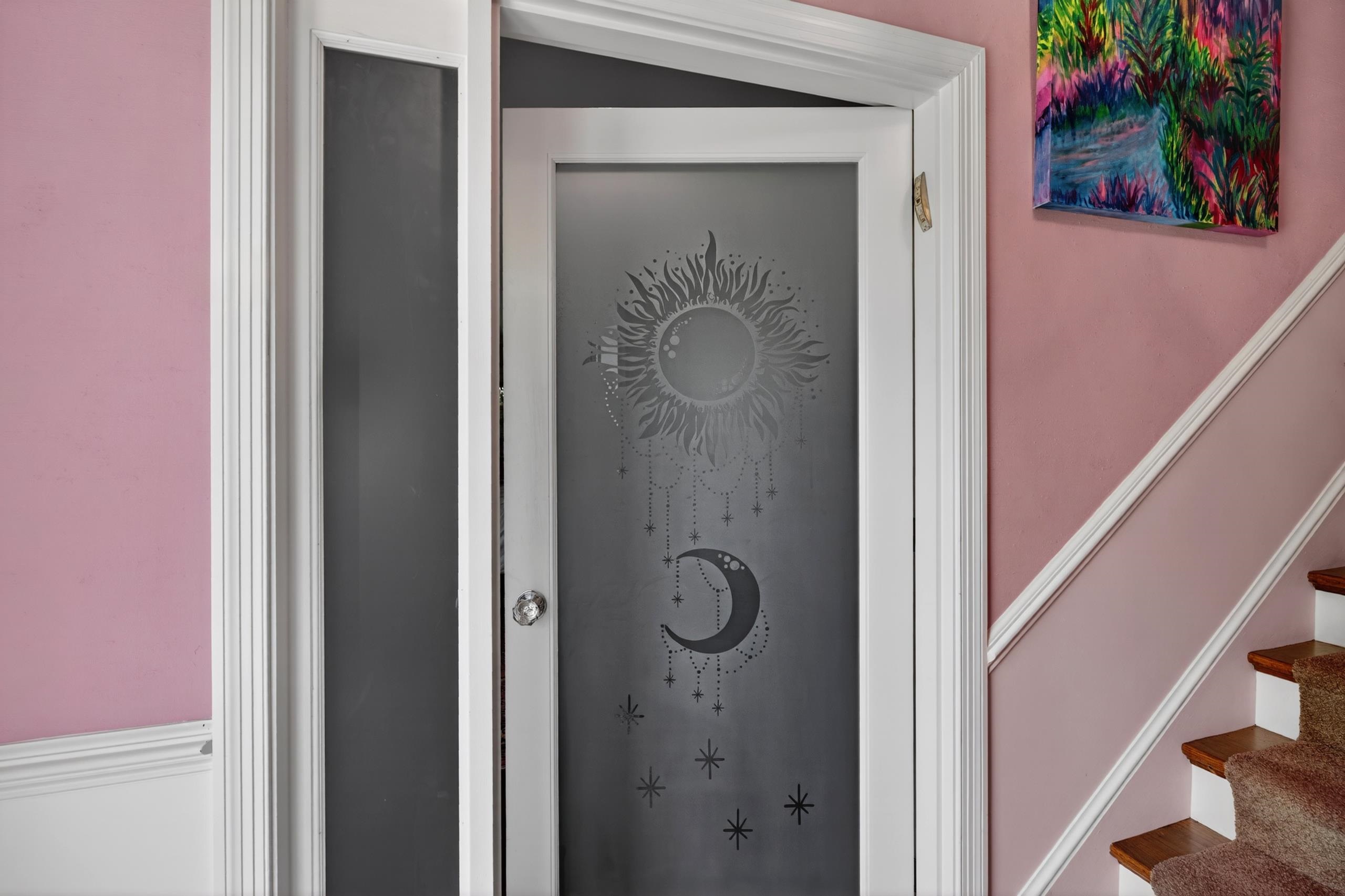 Etched Glass representing day to night on door of primary bedroom