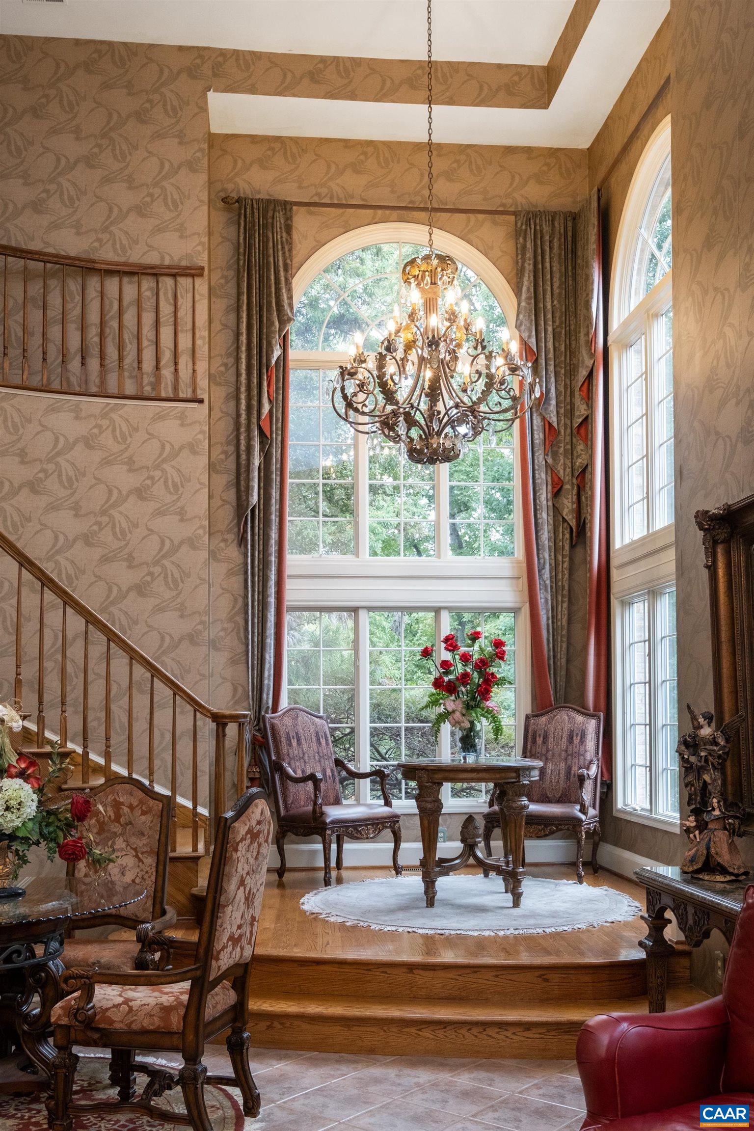 Chandelier featured in the corner windows, well positioned to also be visible from the exterior.