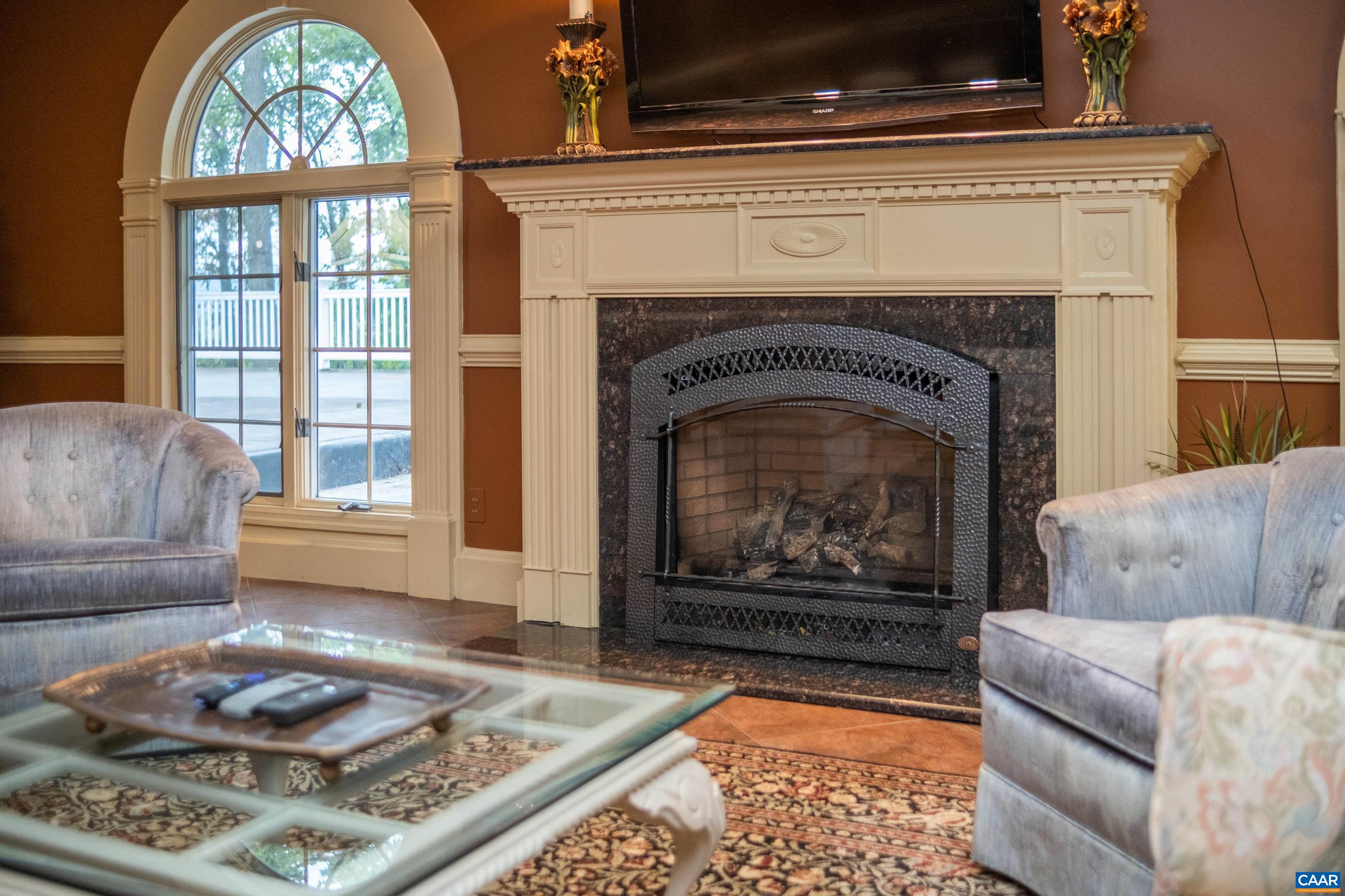 Close up of the fireplace is in view.