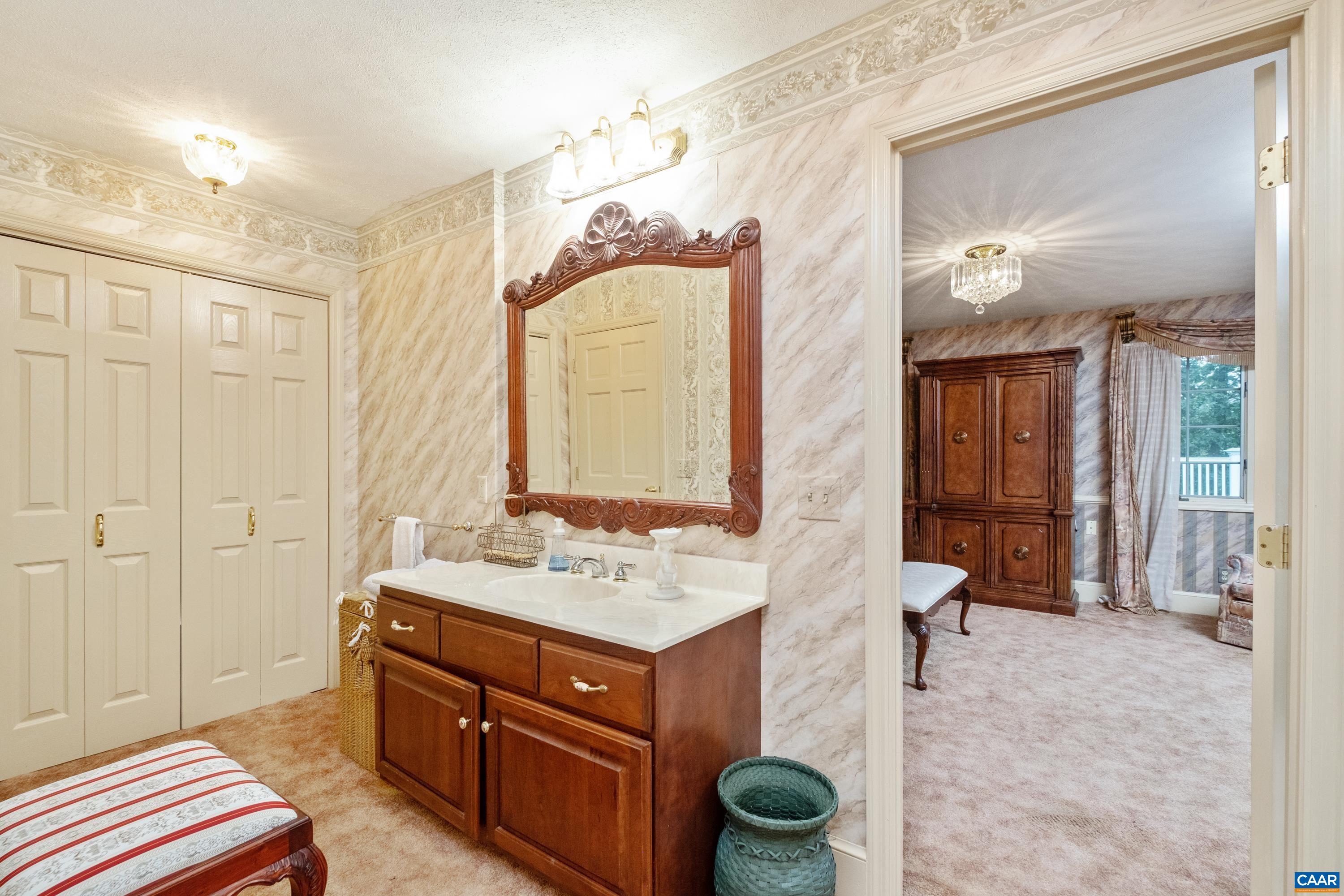 Dressing area, a second sink with vanity, and plenty of storage.
