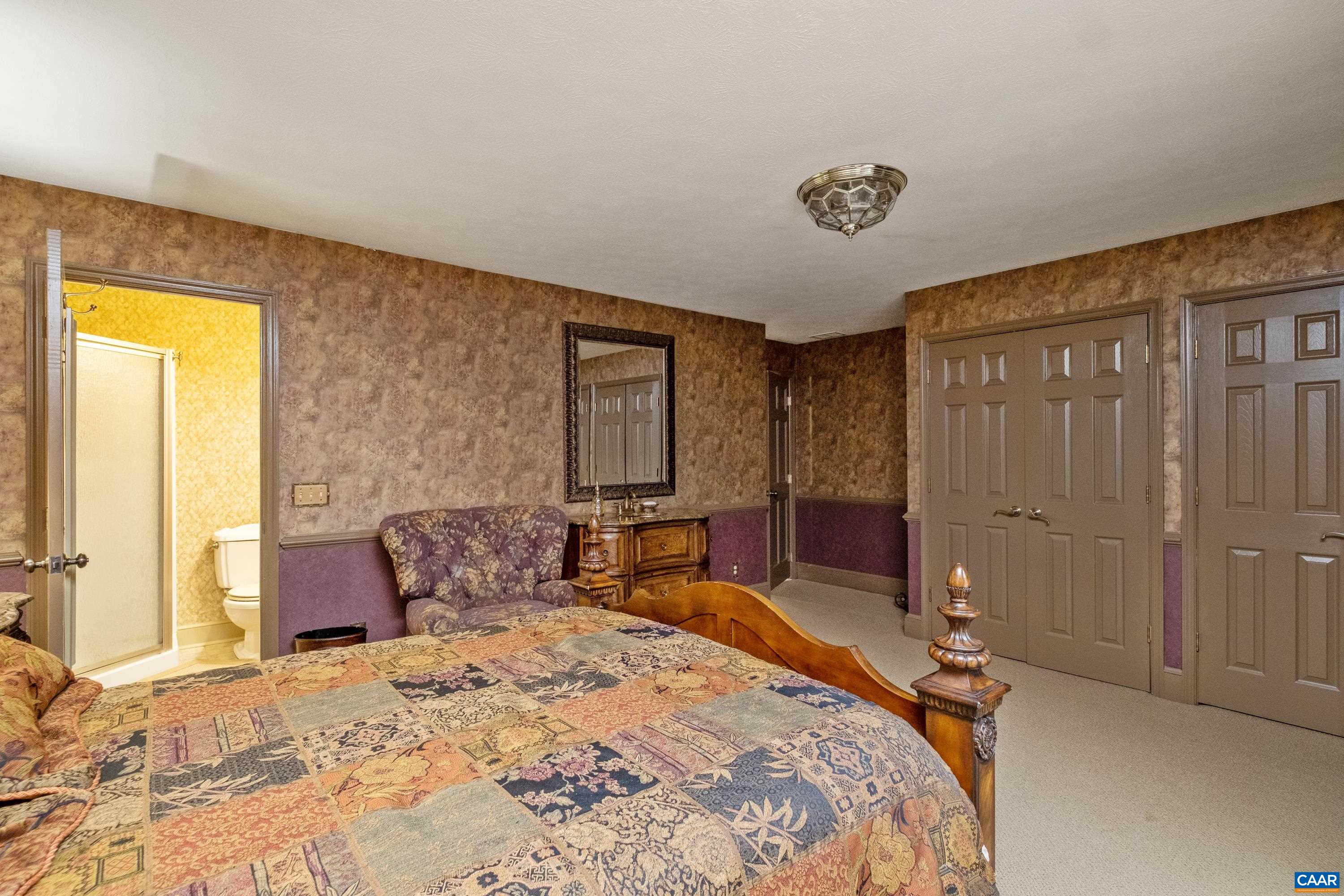 Alternate view of primary suite #3. Vanity with sink in the bedroom, with a pedestal sink in the ensuite bathroom (pictured next).
