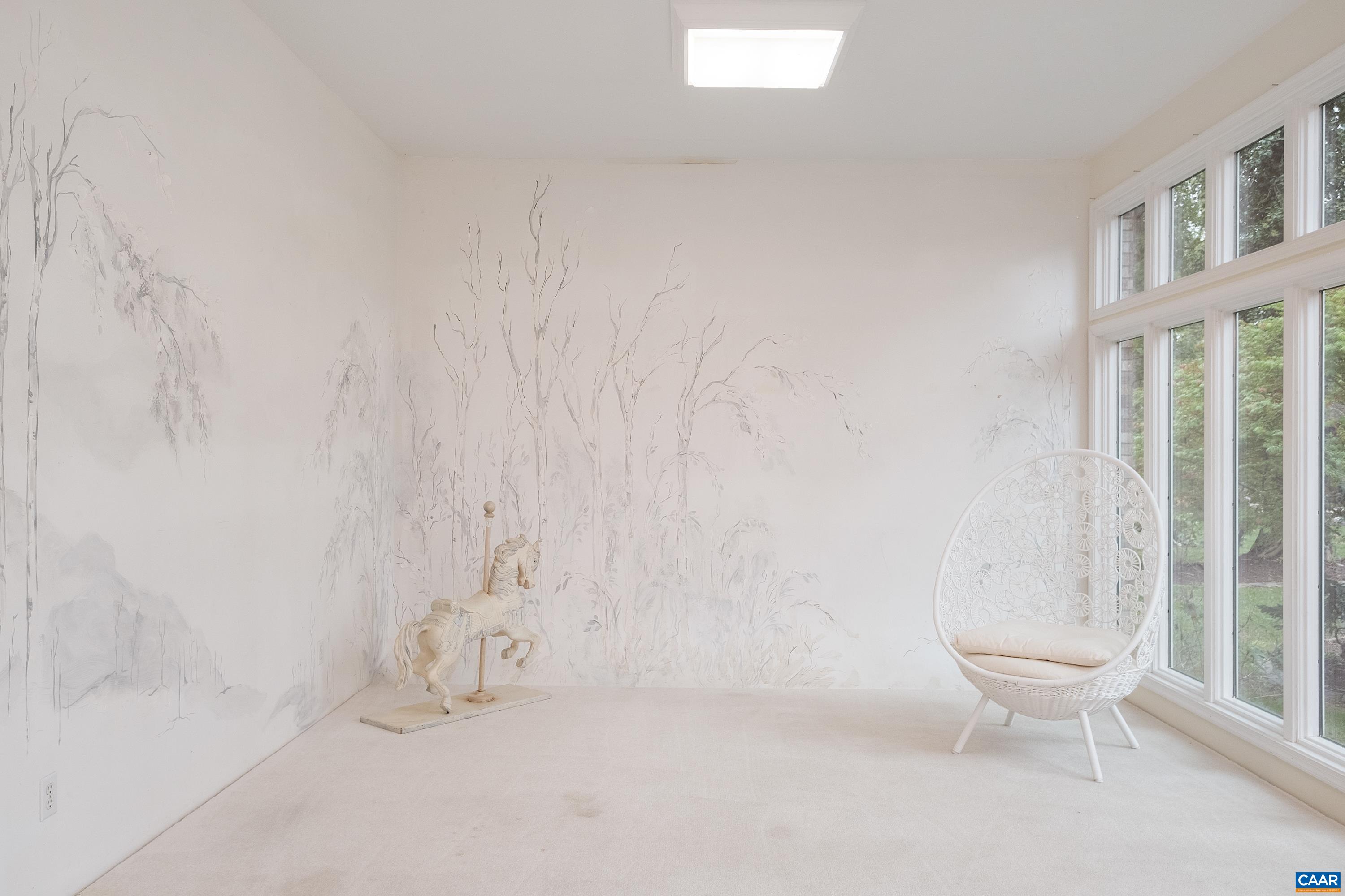 Alternate view of the sunroom, currently being used as a photography studio.