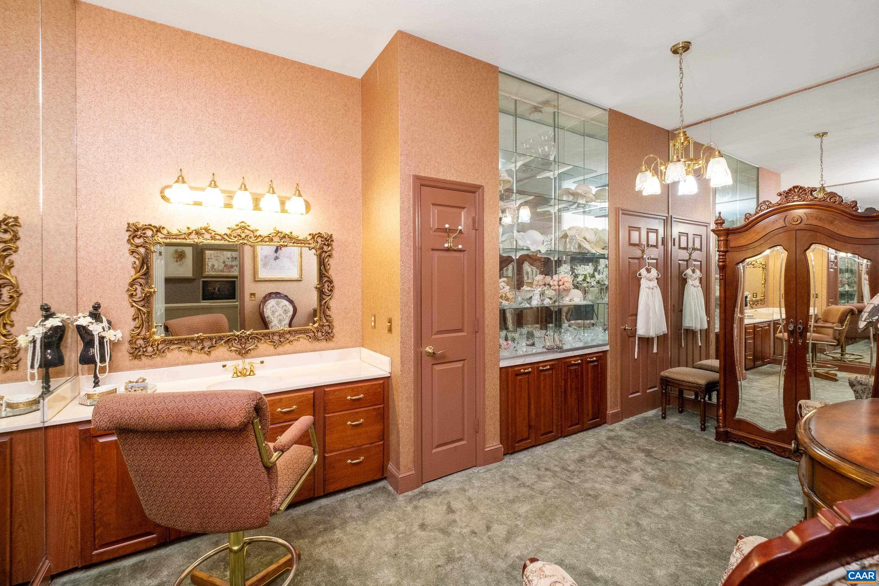 Room is currently being used as a dressing room, and features plenty of closet space and a sink.