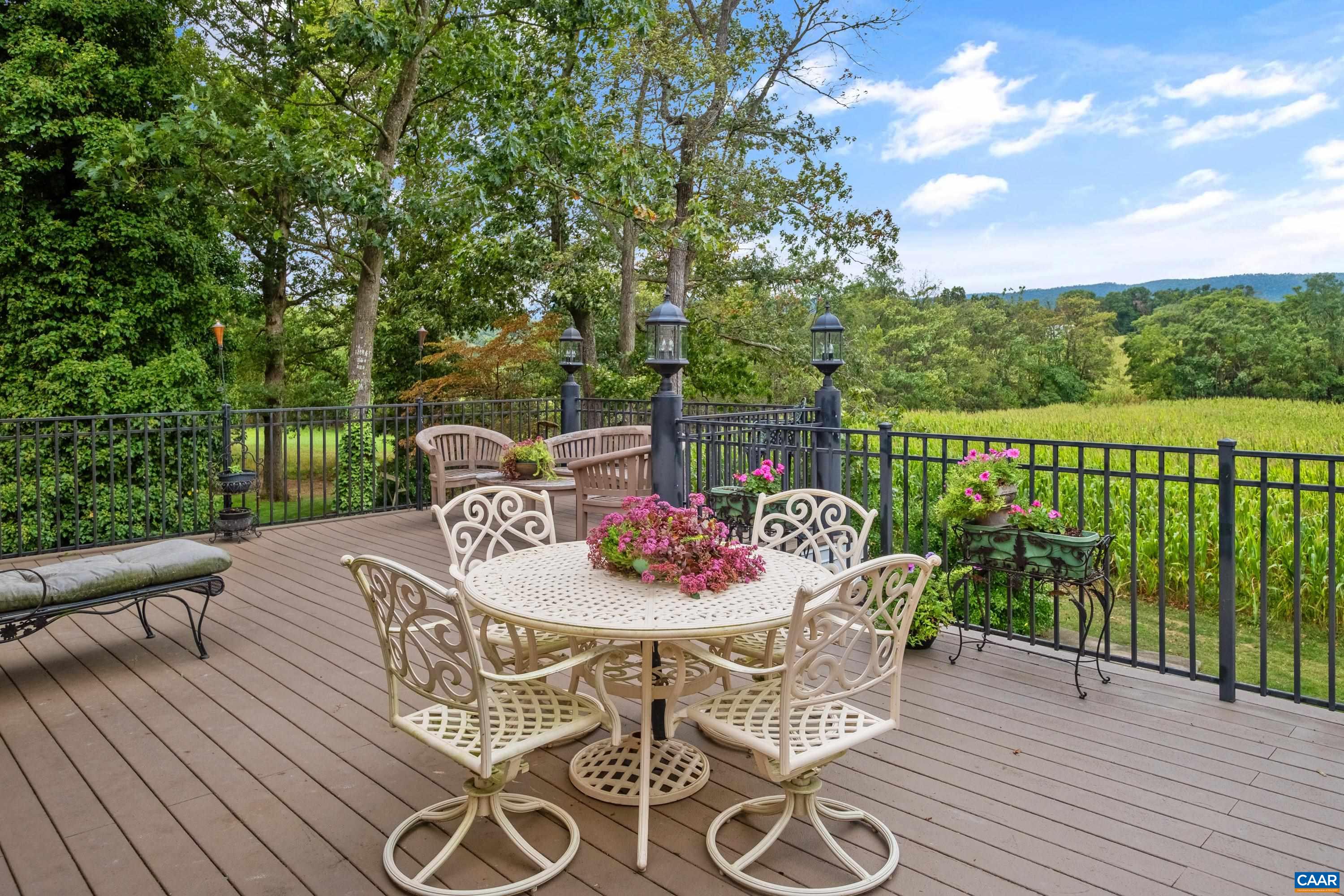 Second level deck, above the covered patio and off the second level kitchen.  Enjoy beautiful mountain views.