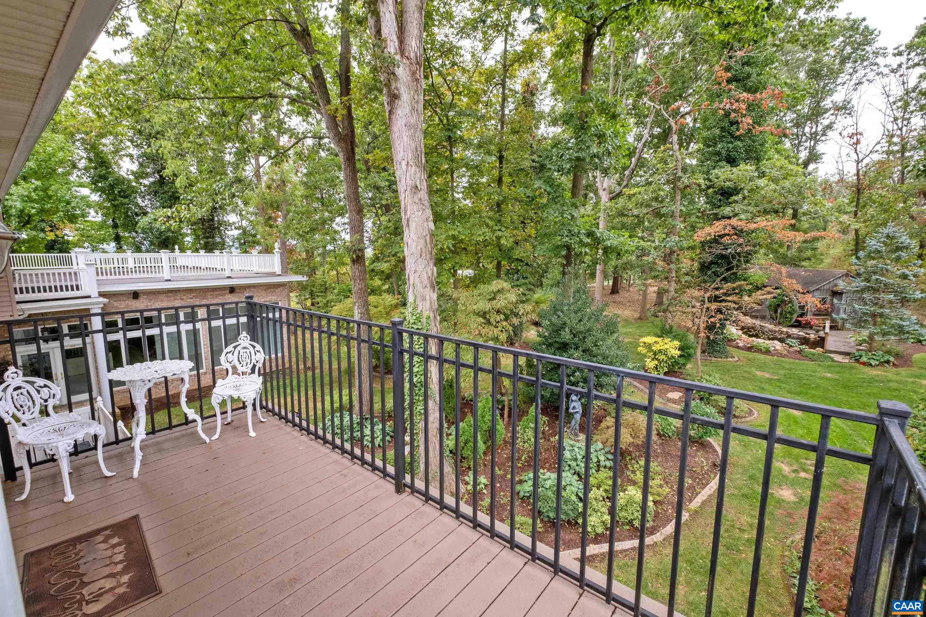 The second level deck wraps around to the side of the house, and can be accessed from the interior by a second door from the kitchen.