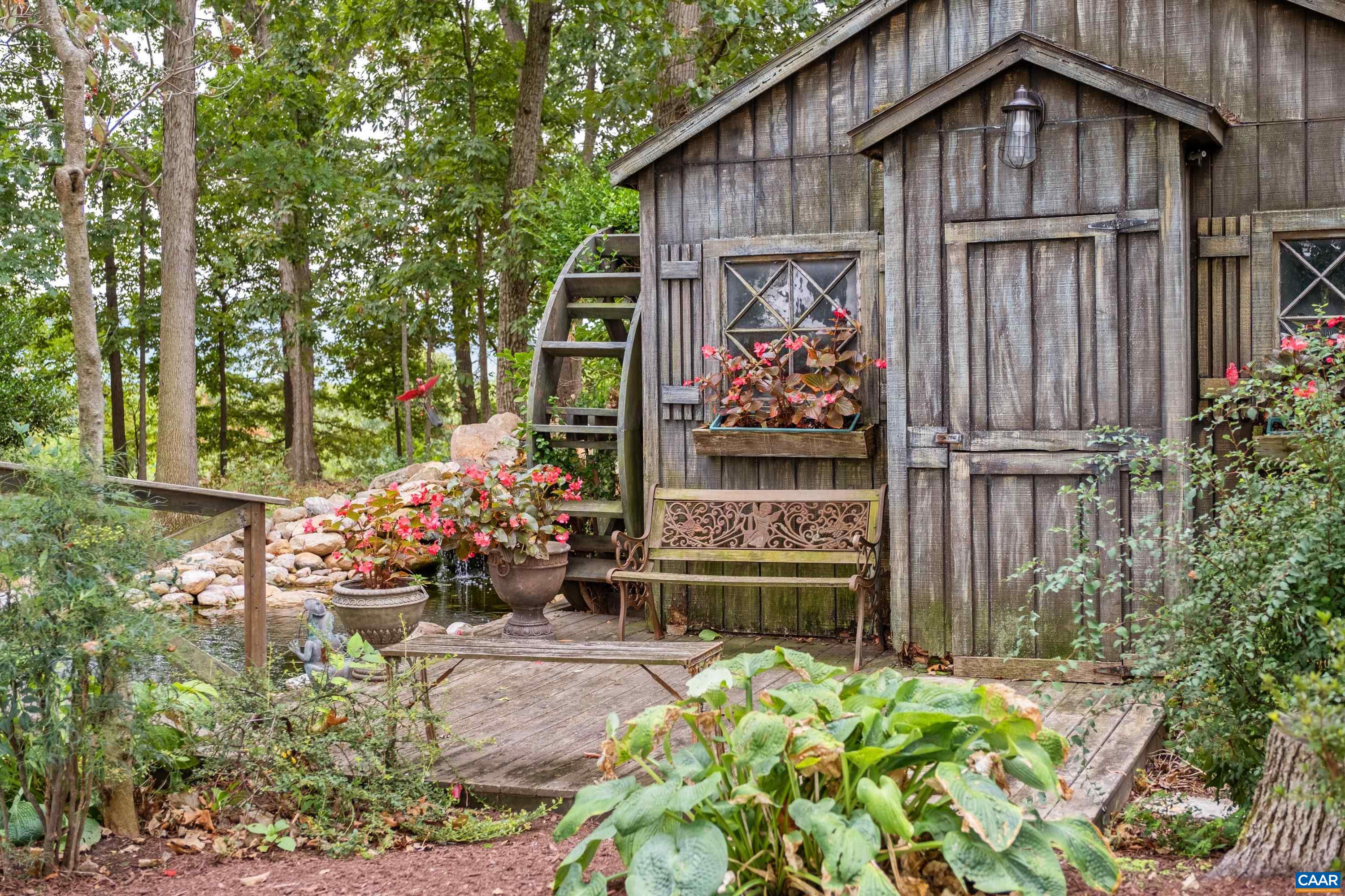 Beautiful and lush landscaping surrounds the mill and pond.