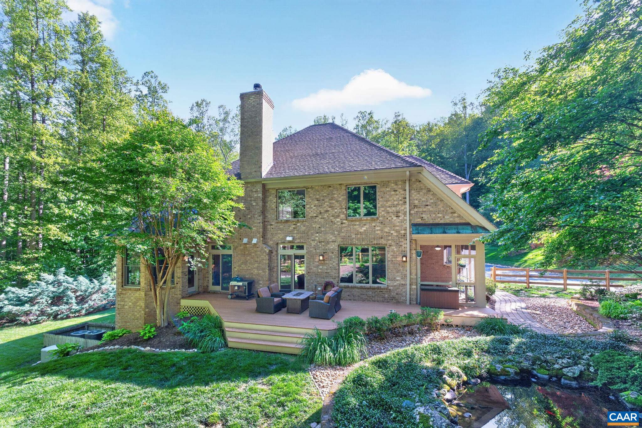 Rear of home showing beautifully landscaped grounds. Rear of home showing beautifully landscaped grounds.