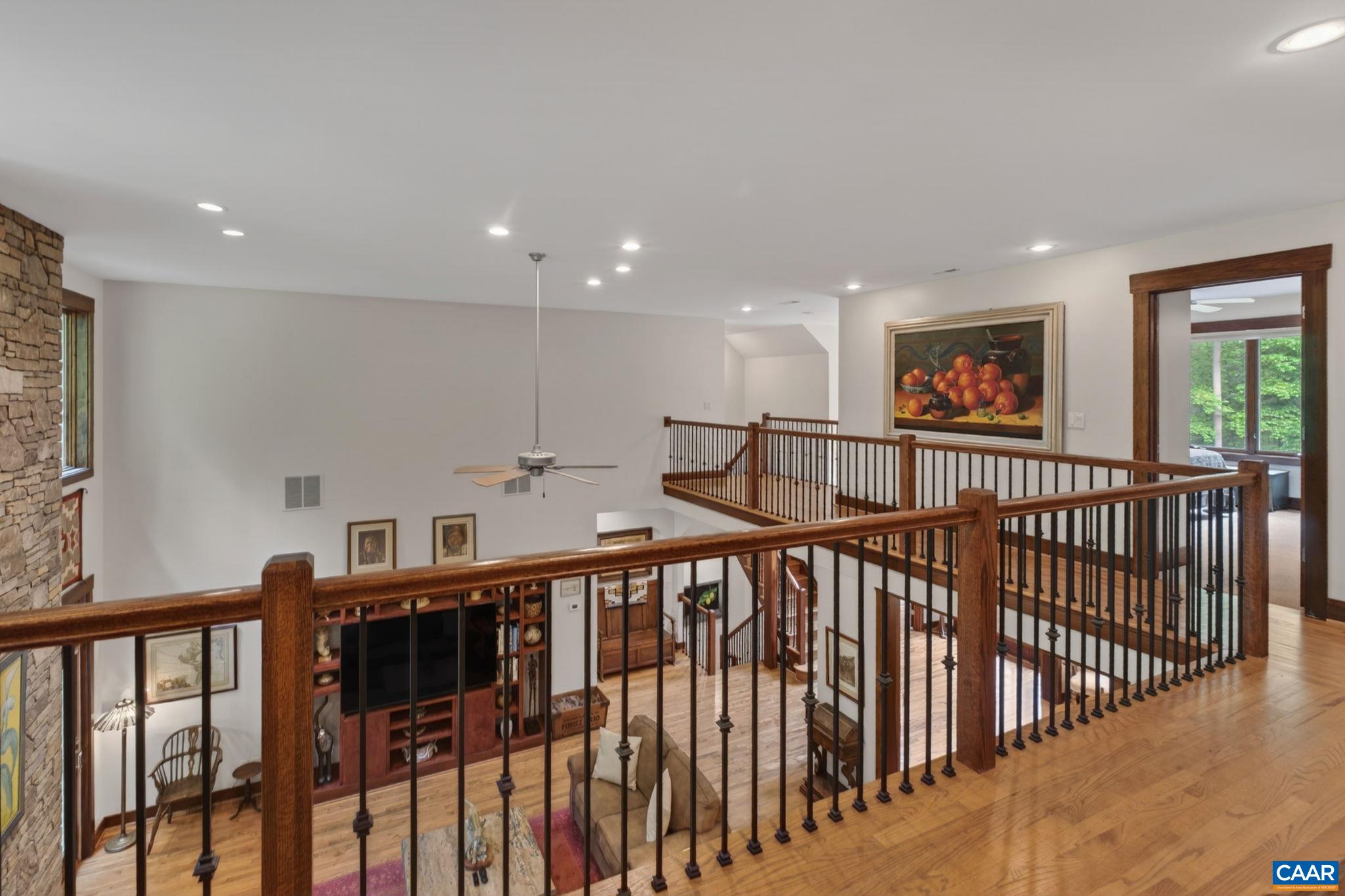 Upper level walkway overlooks the great room. Upper level walkway overlooks the great room.