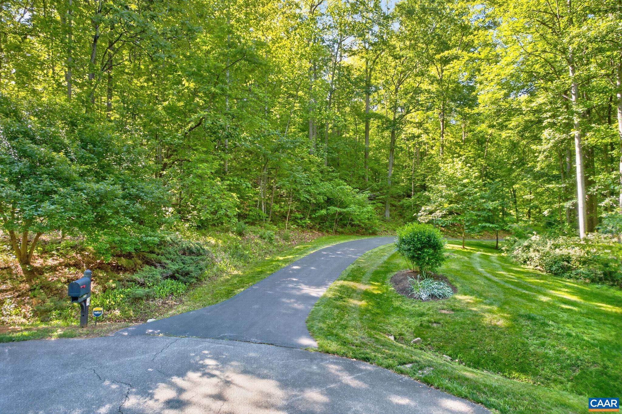 Looking up the driveway from the street front cul-de-sac. Looking up the driveway from the street front cul-de-sac.