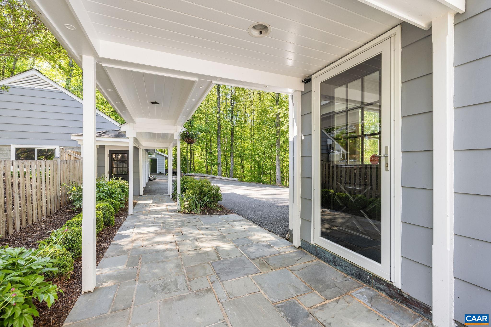 Covered breezeway from the garage to the home.