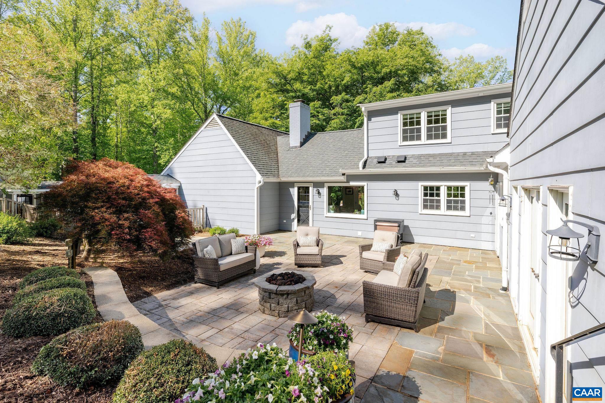 The private rear yard is the perfect spot for relaxing or entertaining.  Two stone firepits, one gas and one wood burning, offer plenty of gathering space.