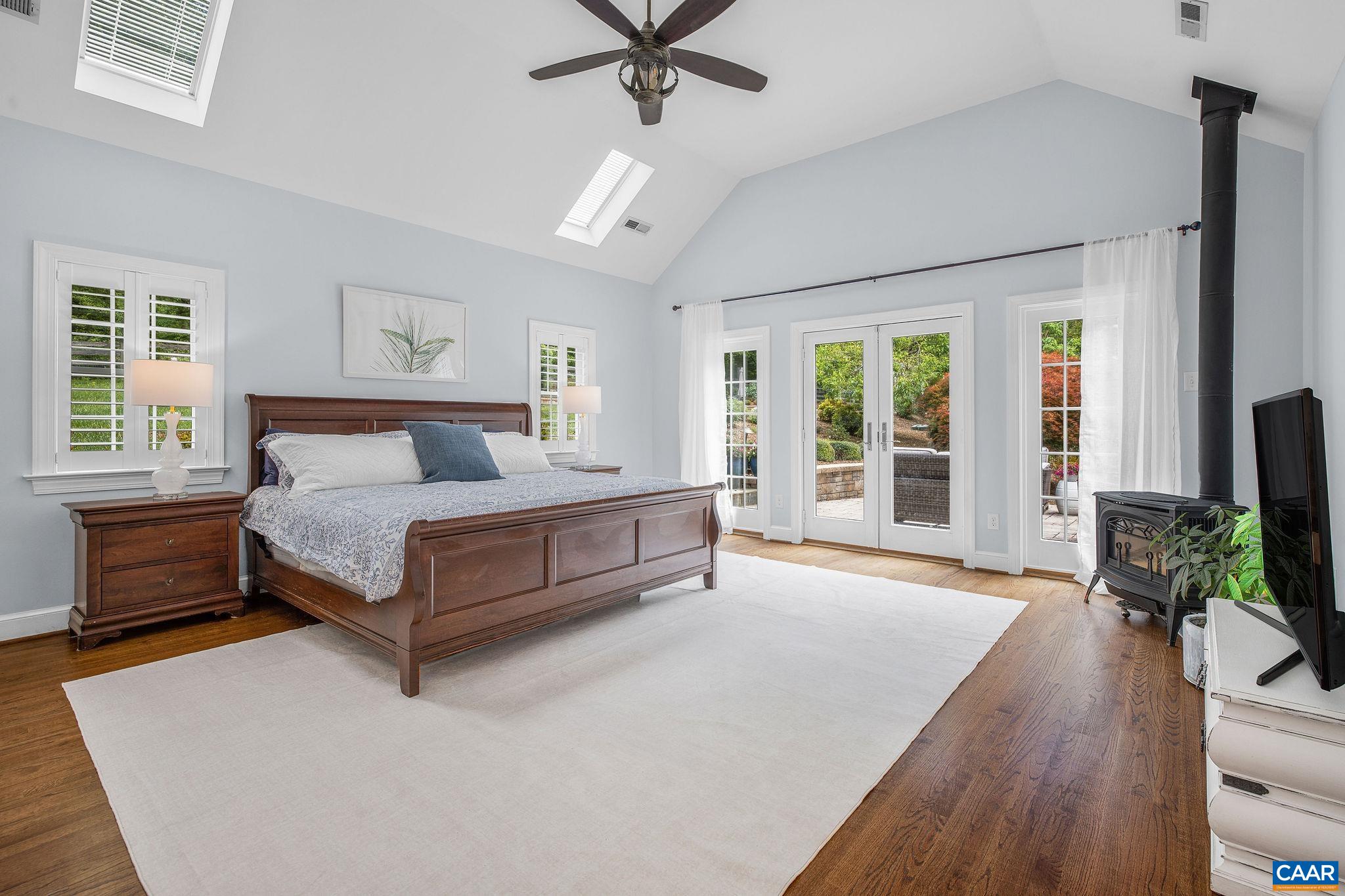 Light-filled primary suite with private access to the rear patio.