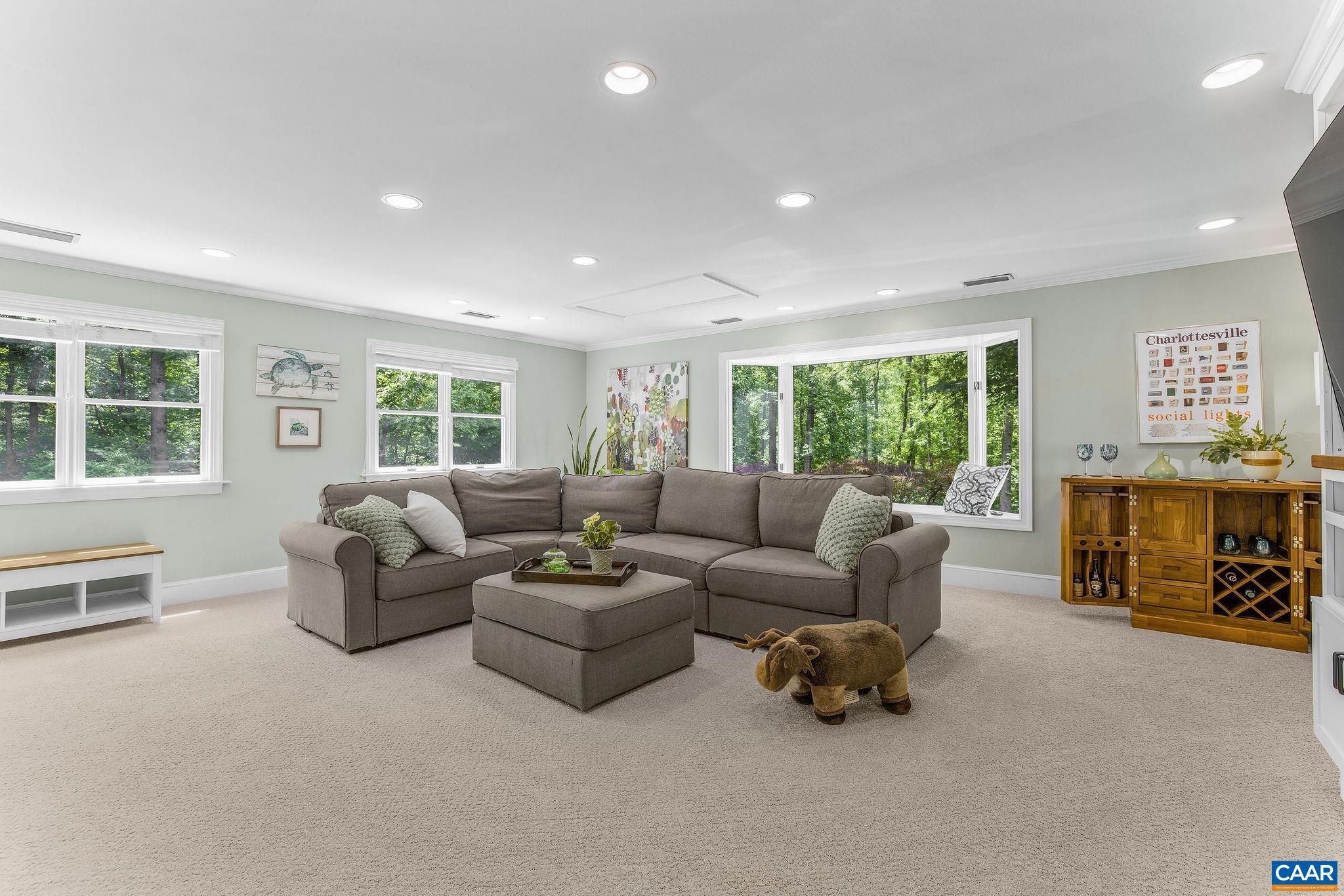 Huge great room with loads of natural light and plenty of space for hanging out, playing games, and watching movies.