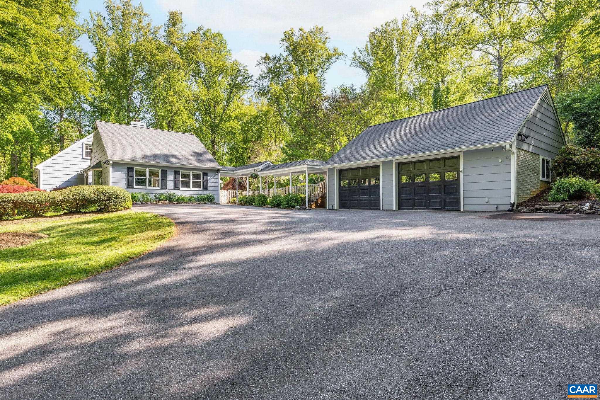 Plenty of parking on the spacious driveway, as well as an oversized 2 car garage.
