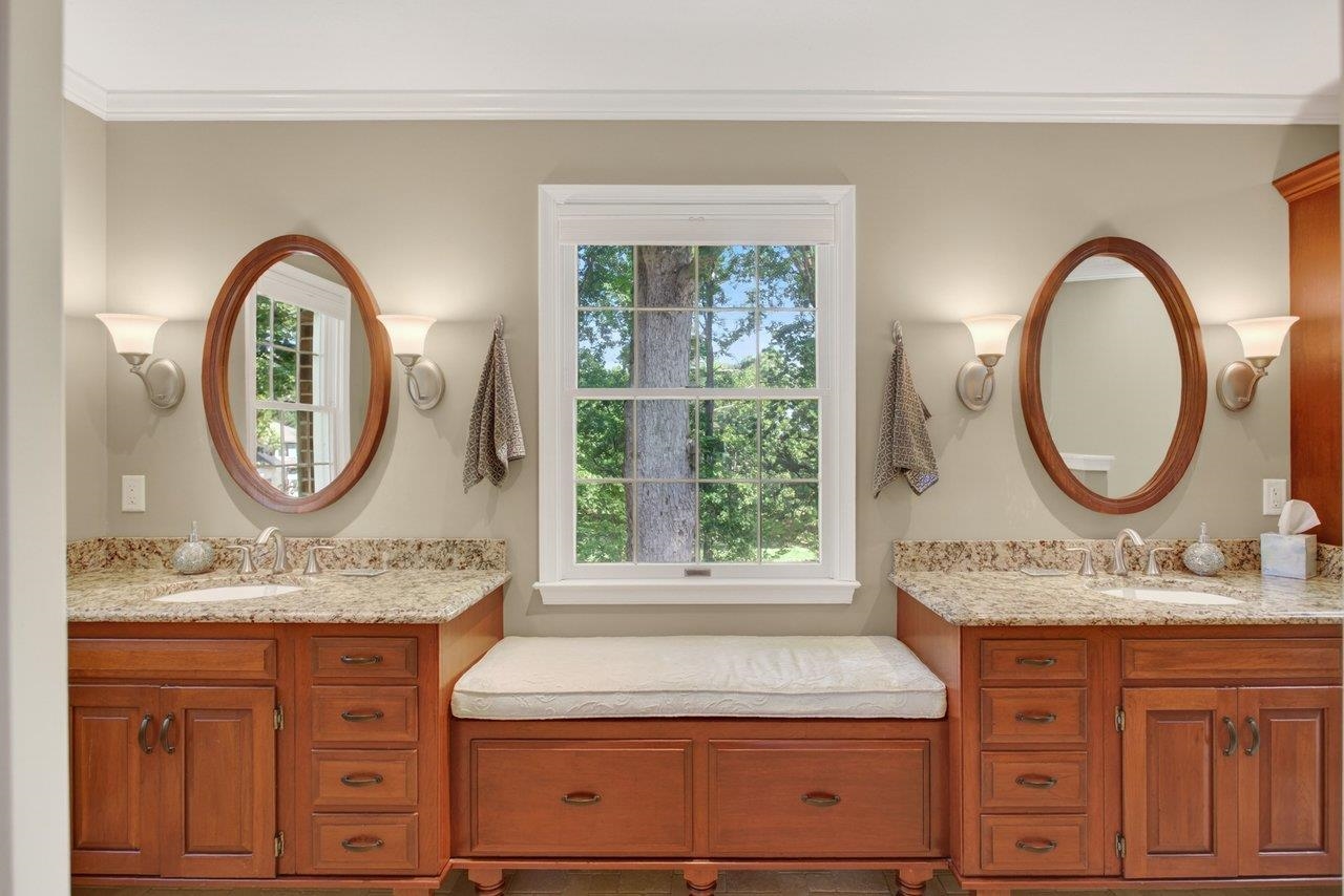 Totally redesigned, this spa-like retreat features separate vanities, a heated tile floor, incredible shower, heated towel rack and additional storage in the window seat Totally redesigned, this spa-like retreat features separate vanities, a heated tile floor, incredible shower, heated towel rack and additional storage in the window seat