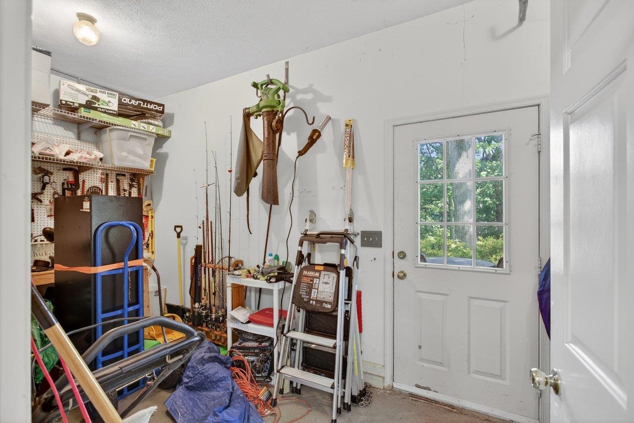 This is conveniently located adjacent to the garage with entrances from inside the garage and from the brick patio This is conveniently located adjacent to the garage with entrances from inside the garage and from the brick patio
