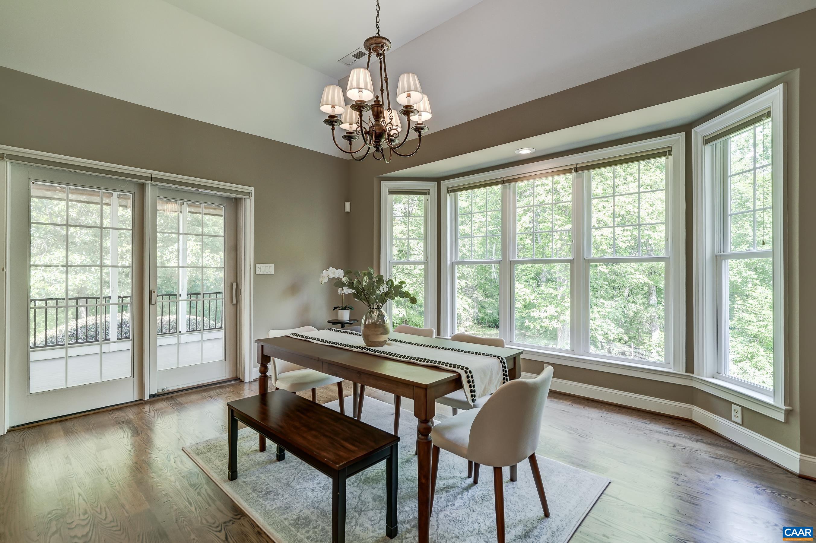 Dining area boasts a large bay window.